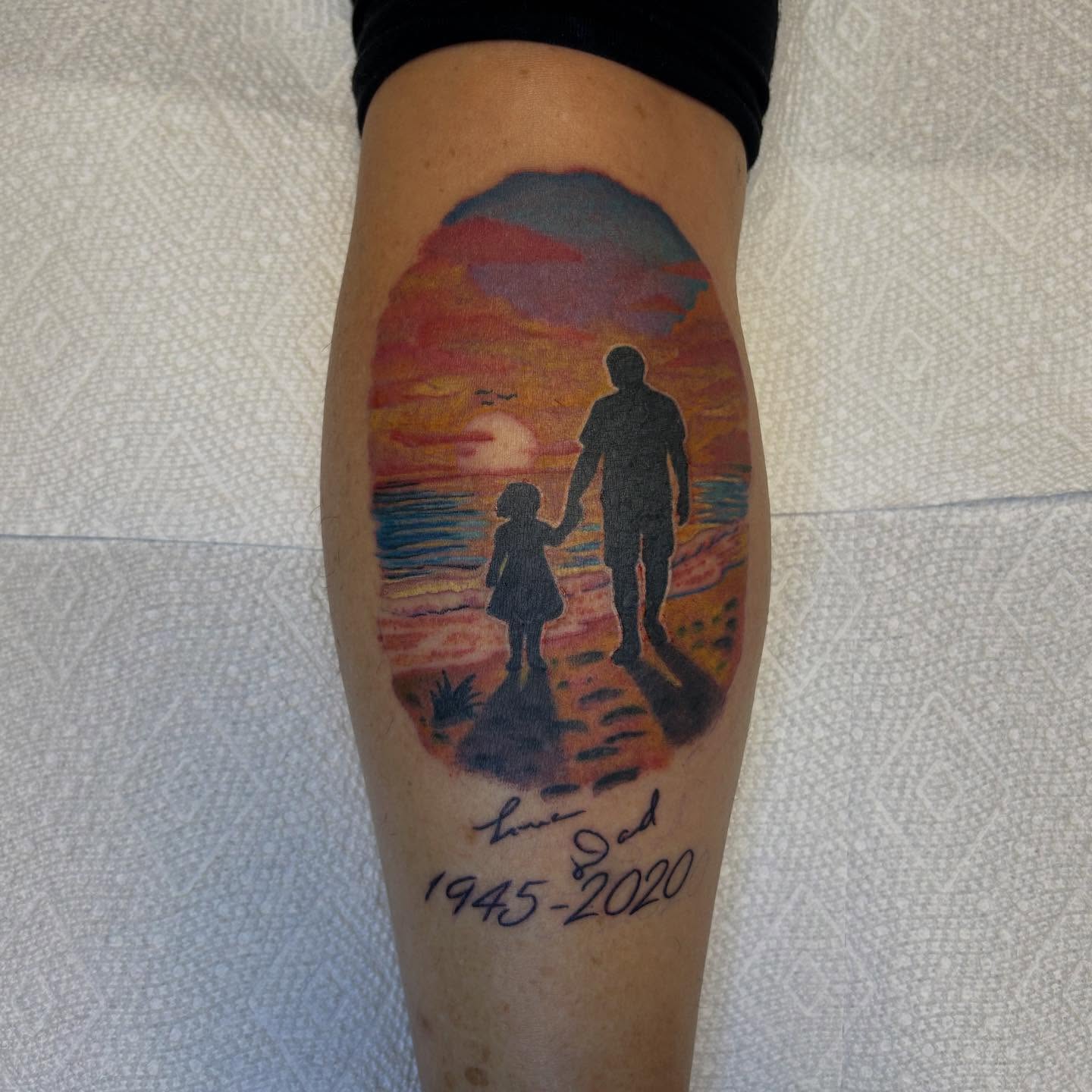 Father and daughter silhouette realism tattoo on the forearm by Randy Bray