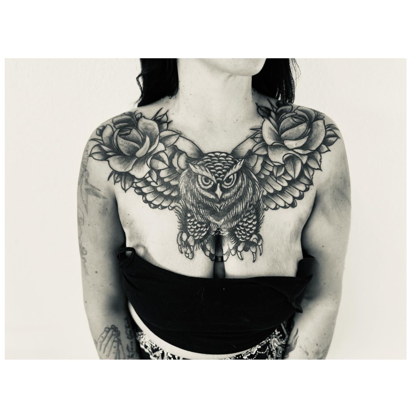 Owl and roses black and grey tattoo on the chest by Jessica Abbey