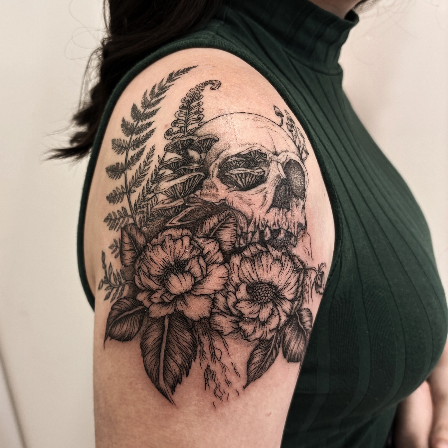 Skull and flowers dotwork tattoo on the shoulder by Tayler, Tooele, Utah