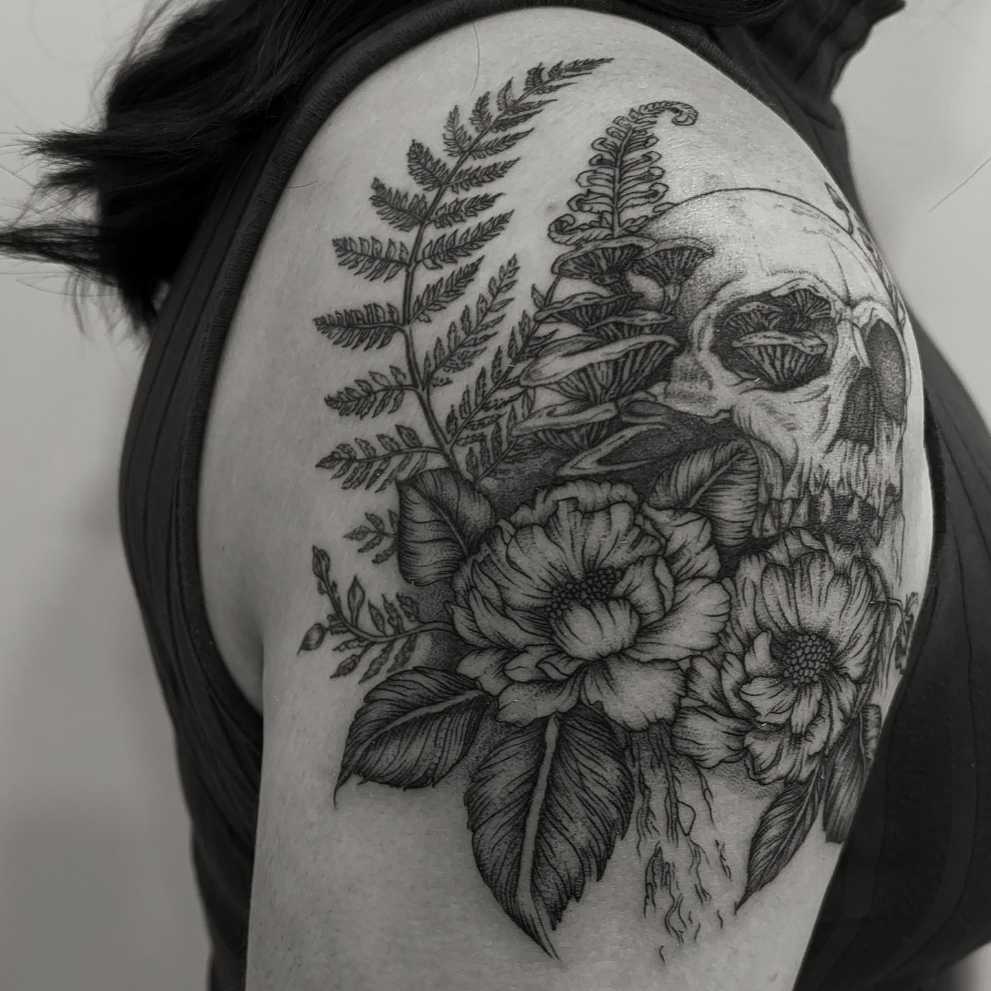 Skull and flowers realism tattoo on the shoulder by Tayler, Tooele, Utah