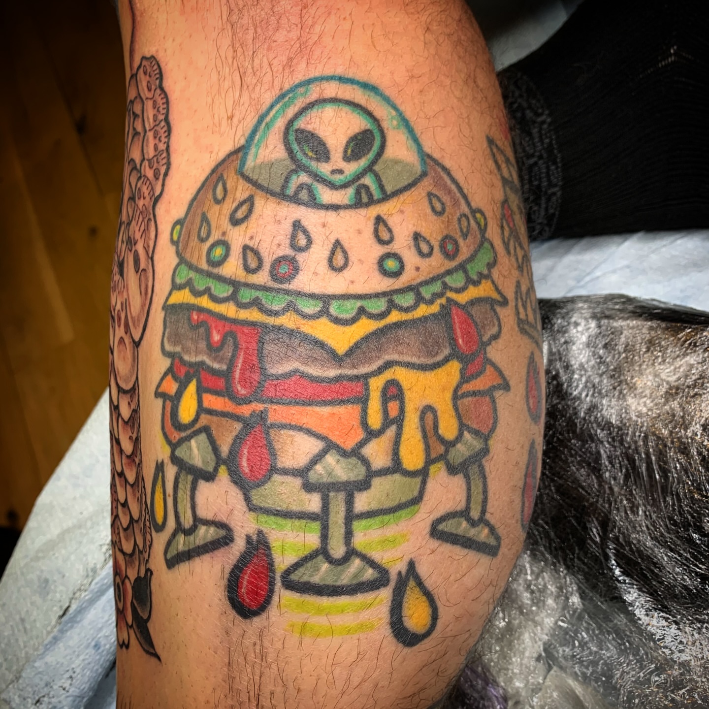 Alien burger American traditional tattoo on the forearm by Destroy Troy