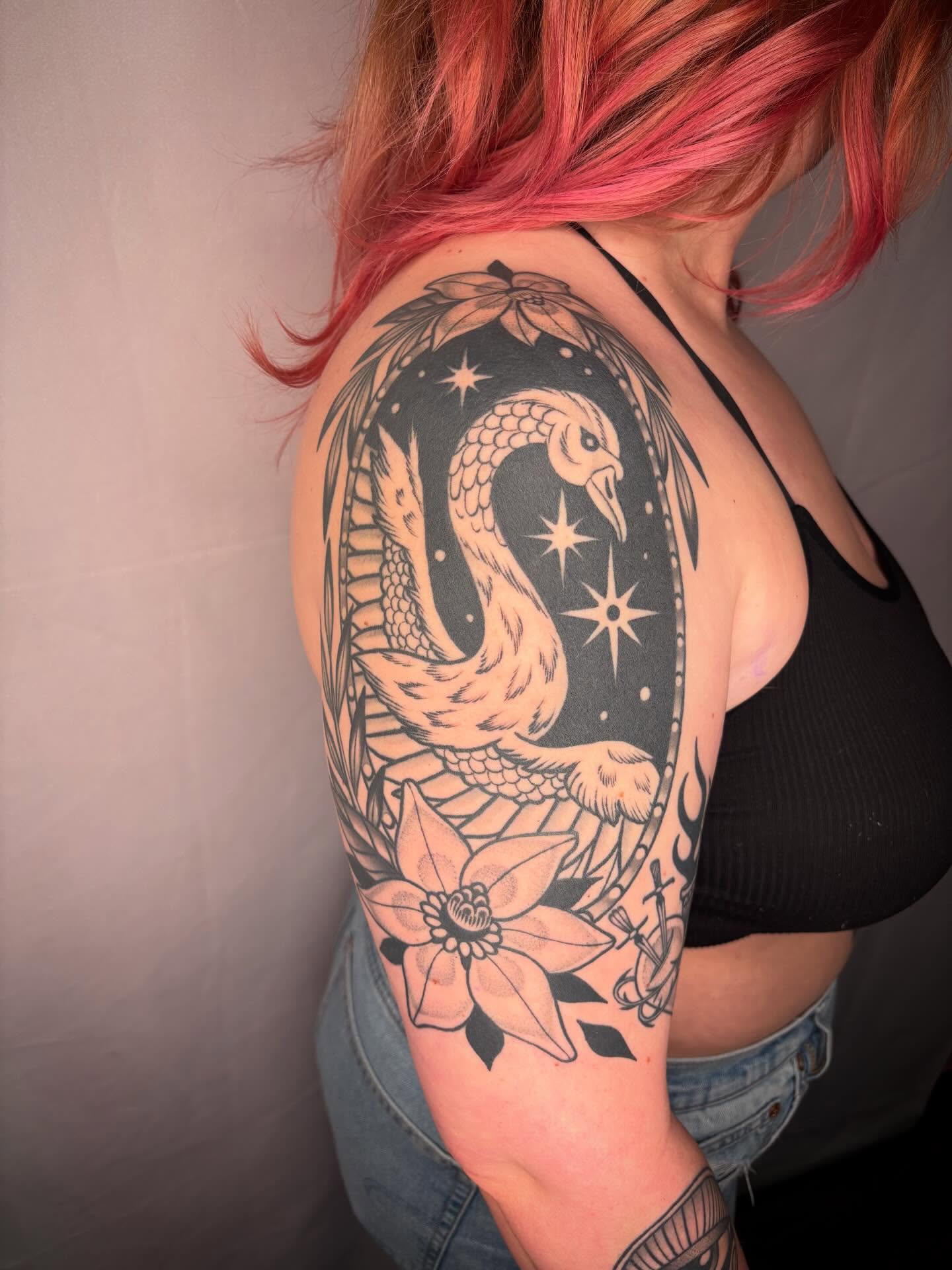 Snake and peony American traditional tattoo on the shoulder by Victoria Bacon