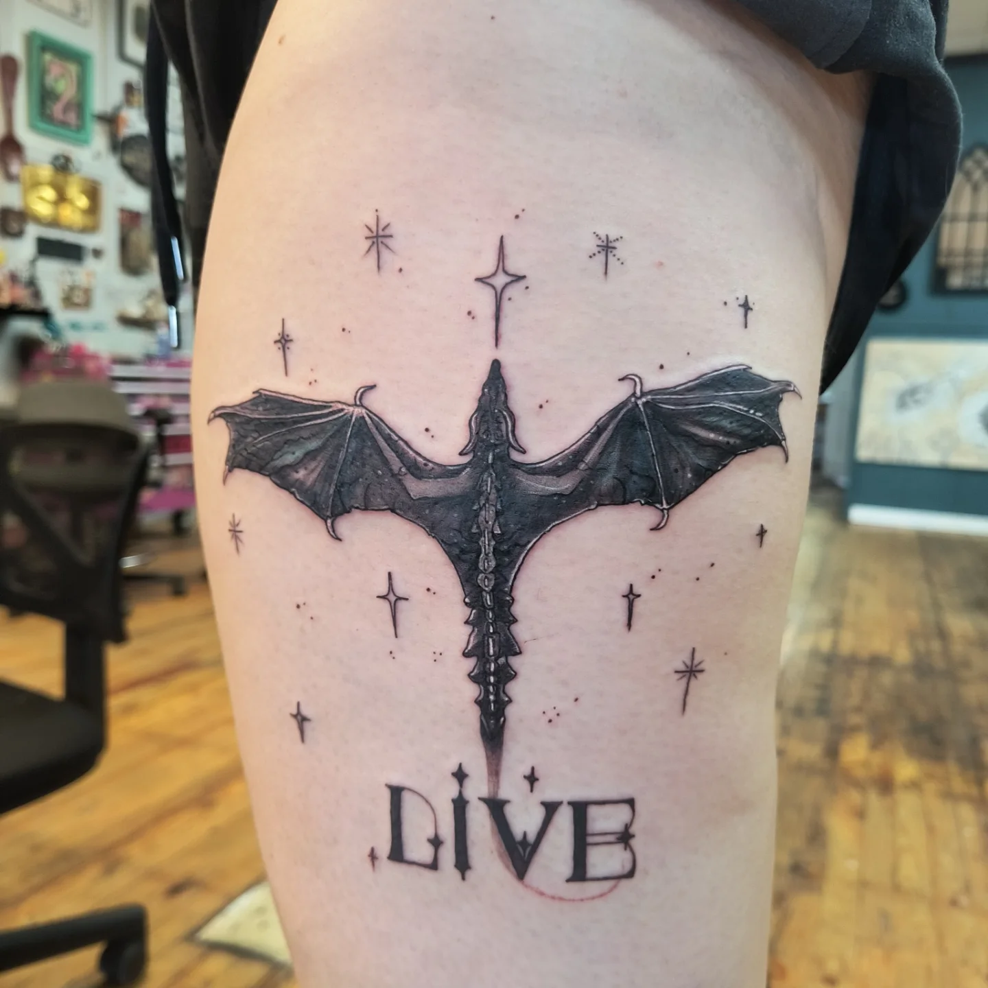 Bat black and grey tattoo on the thigh by Niki Jackson
