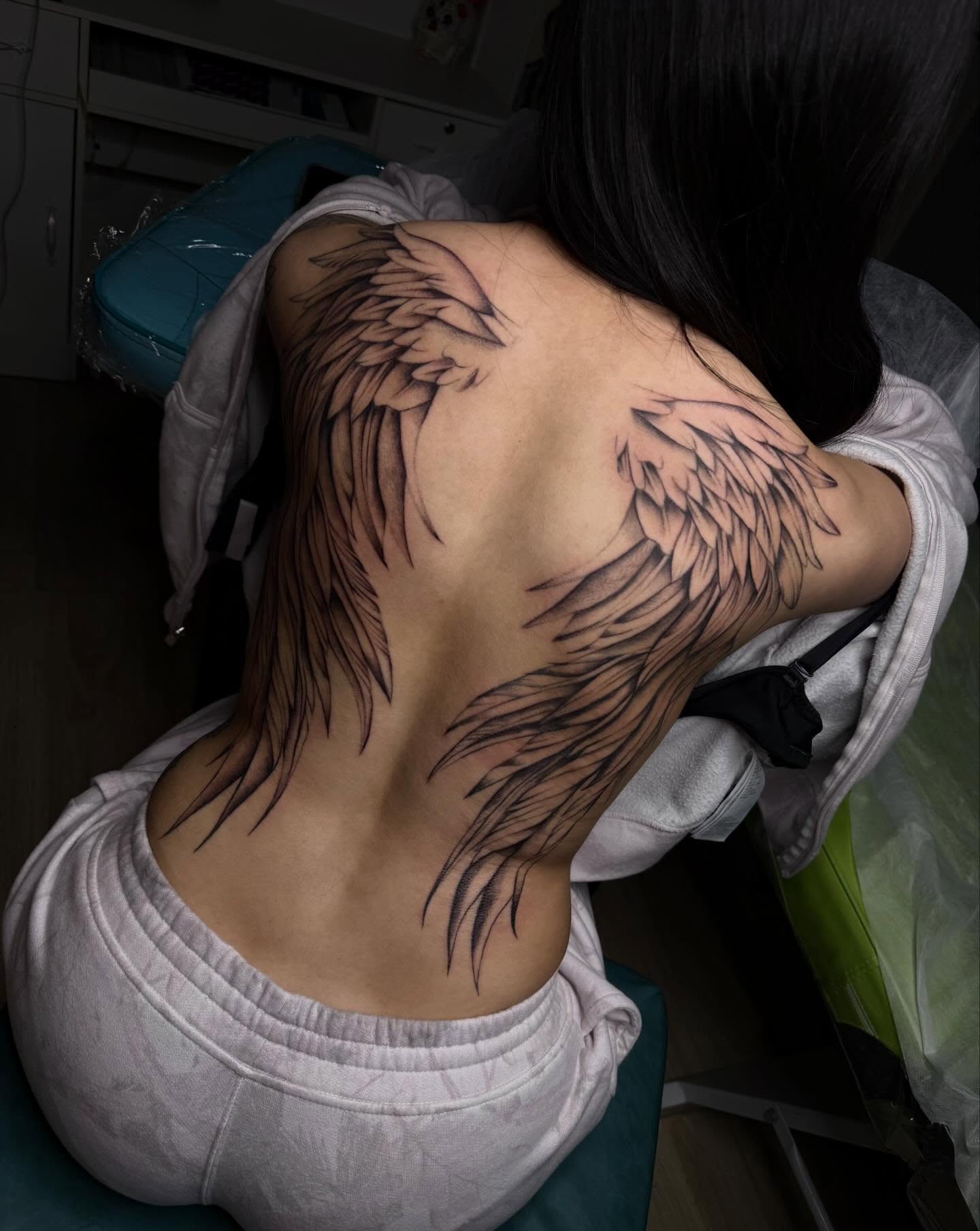 Wings black and grey tattoo on the back by Nadia ★