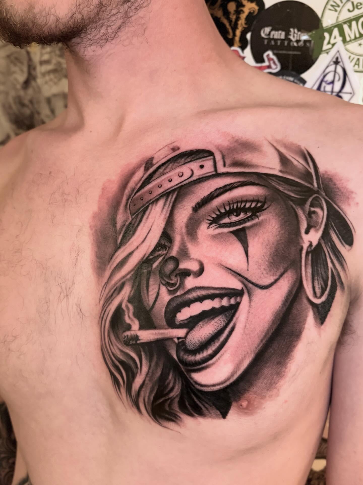 Woman with cigarette realism tattoo on the chest by Italo Holie