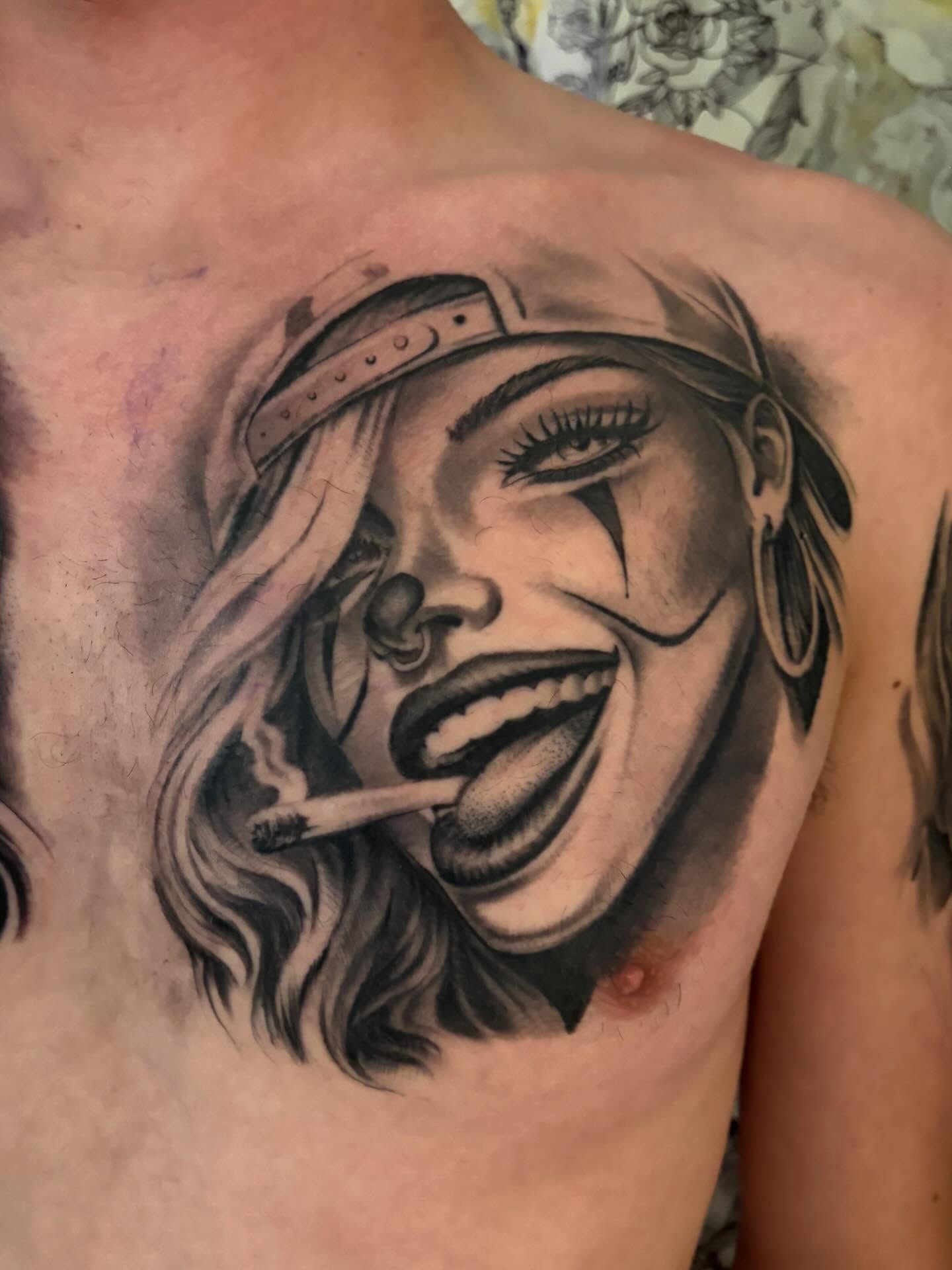Woman with cigarette realism tattoo on the chest by Italo Holie
