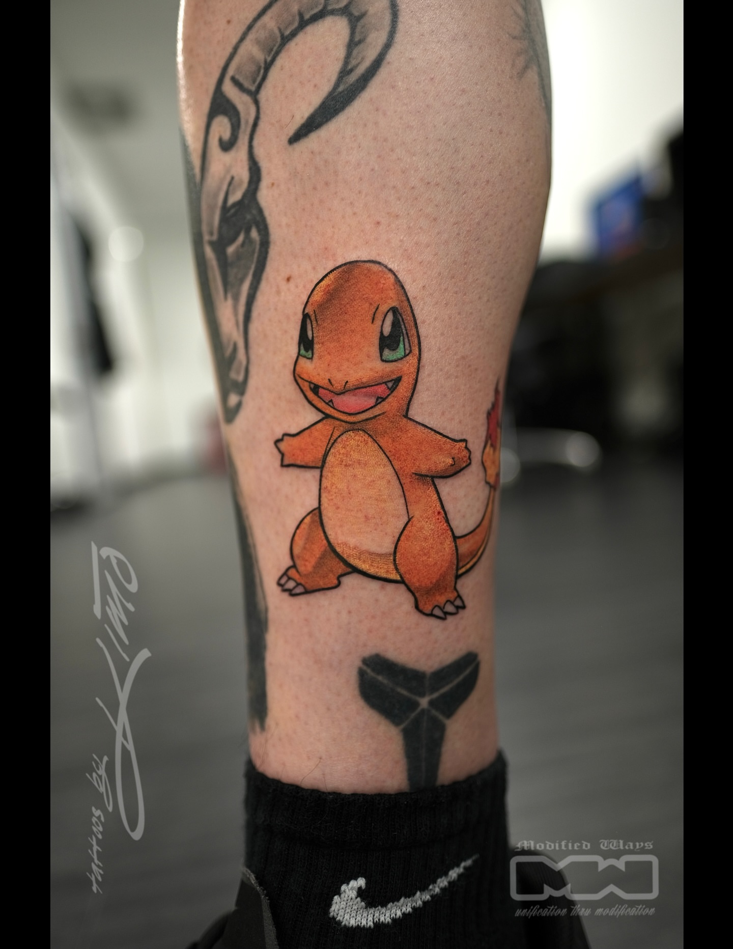 Charmander watercolor tattoo on the forearm by Kansas City tattoo artist