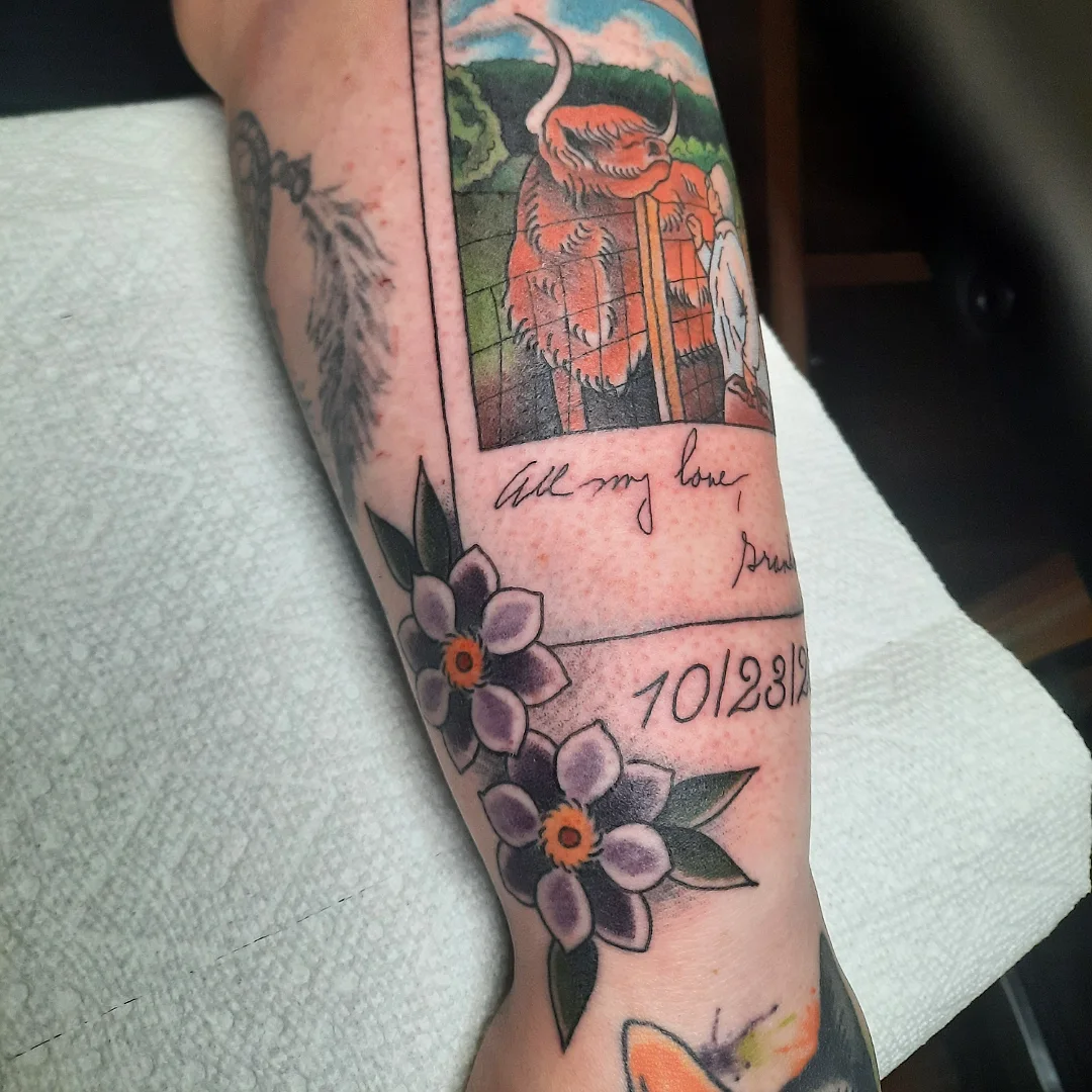 Bull and flowers American traditional tattoo on the forearm by Kaetlyn