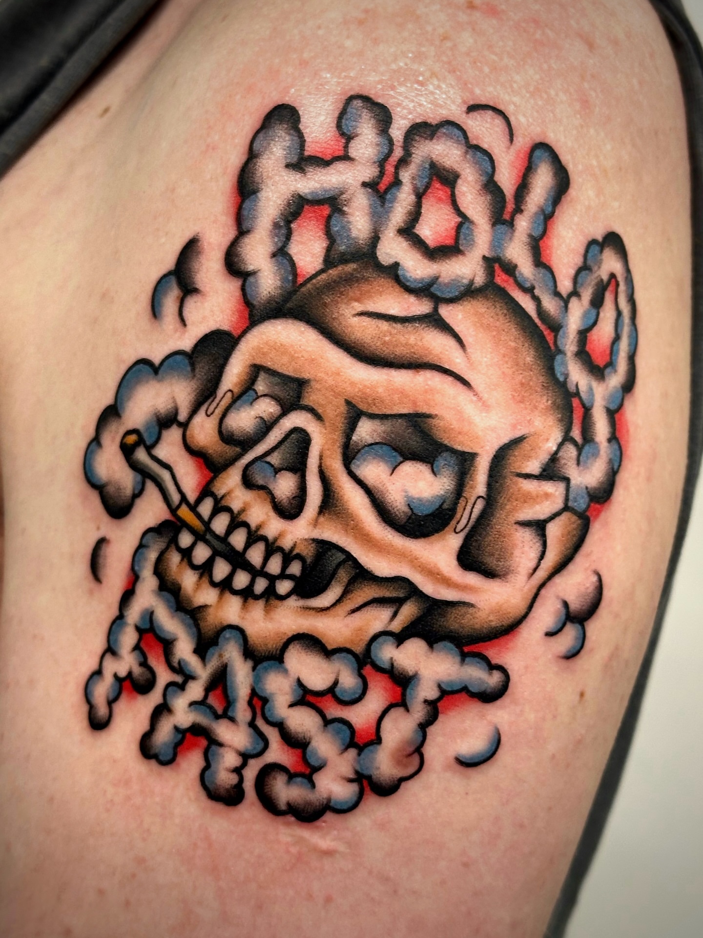 Smoking skull American traditional tattoo on the shoulder by Black and color tattoo!