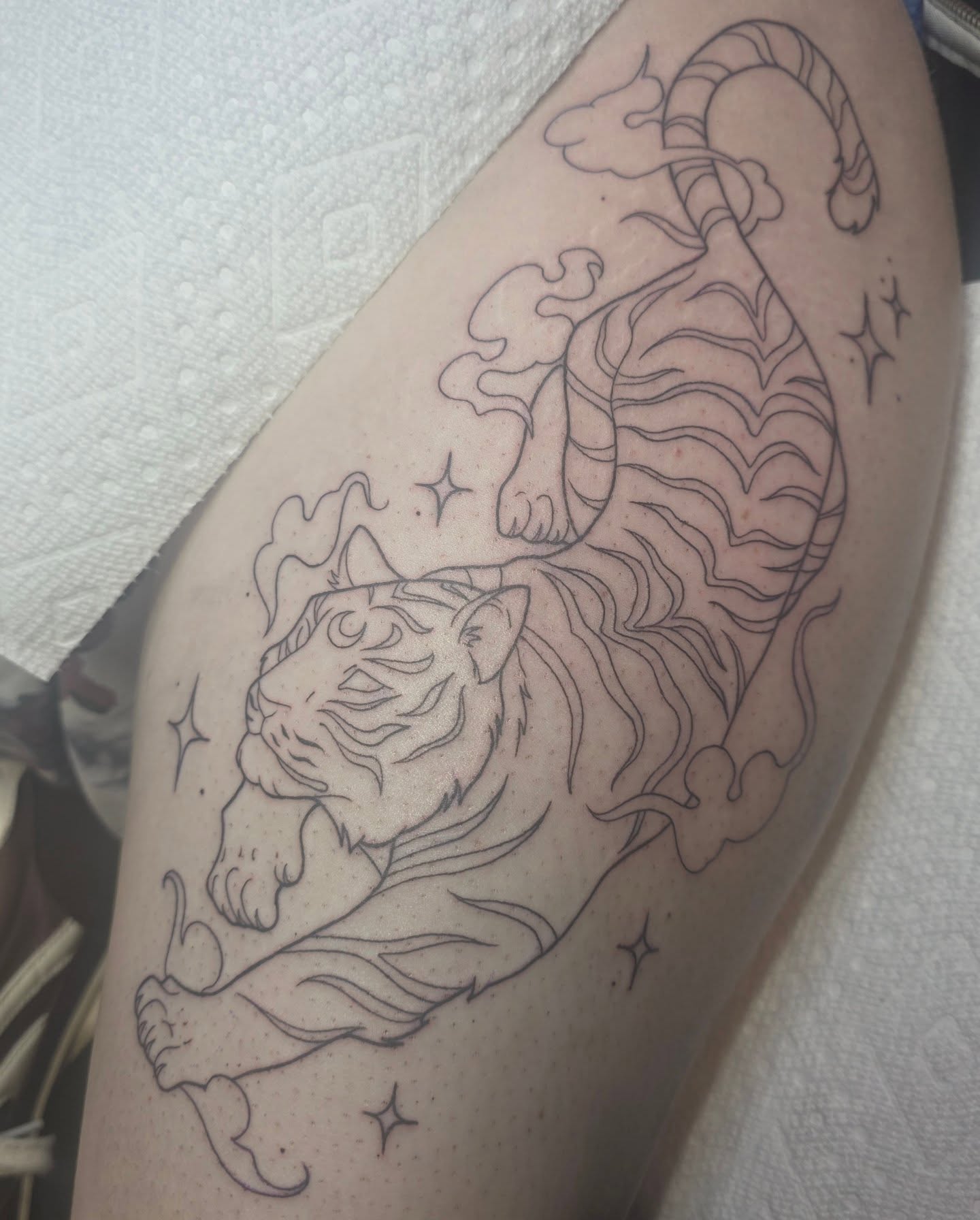 Tiger American traditional tattoo on the thigh by Cassieal Welch
