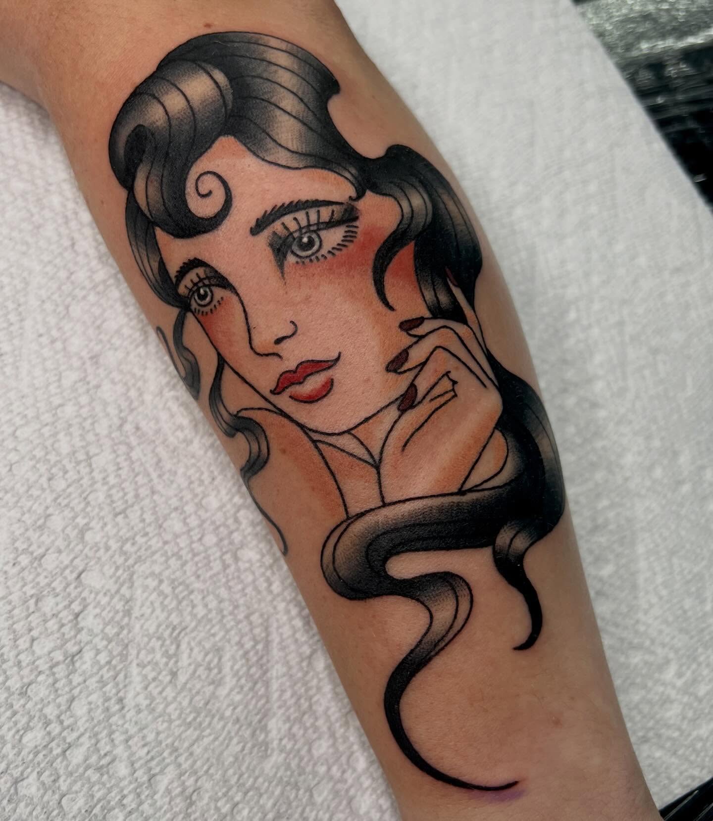 Woman with flowing hair American traditional tattoo on the forearm by Kahlan ⍟