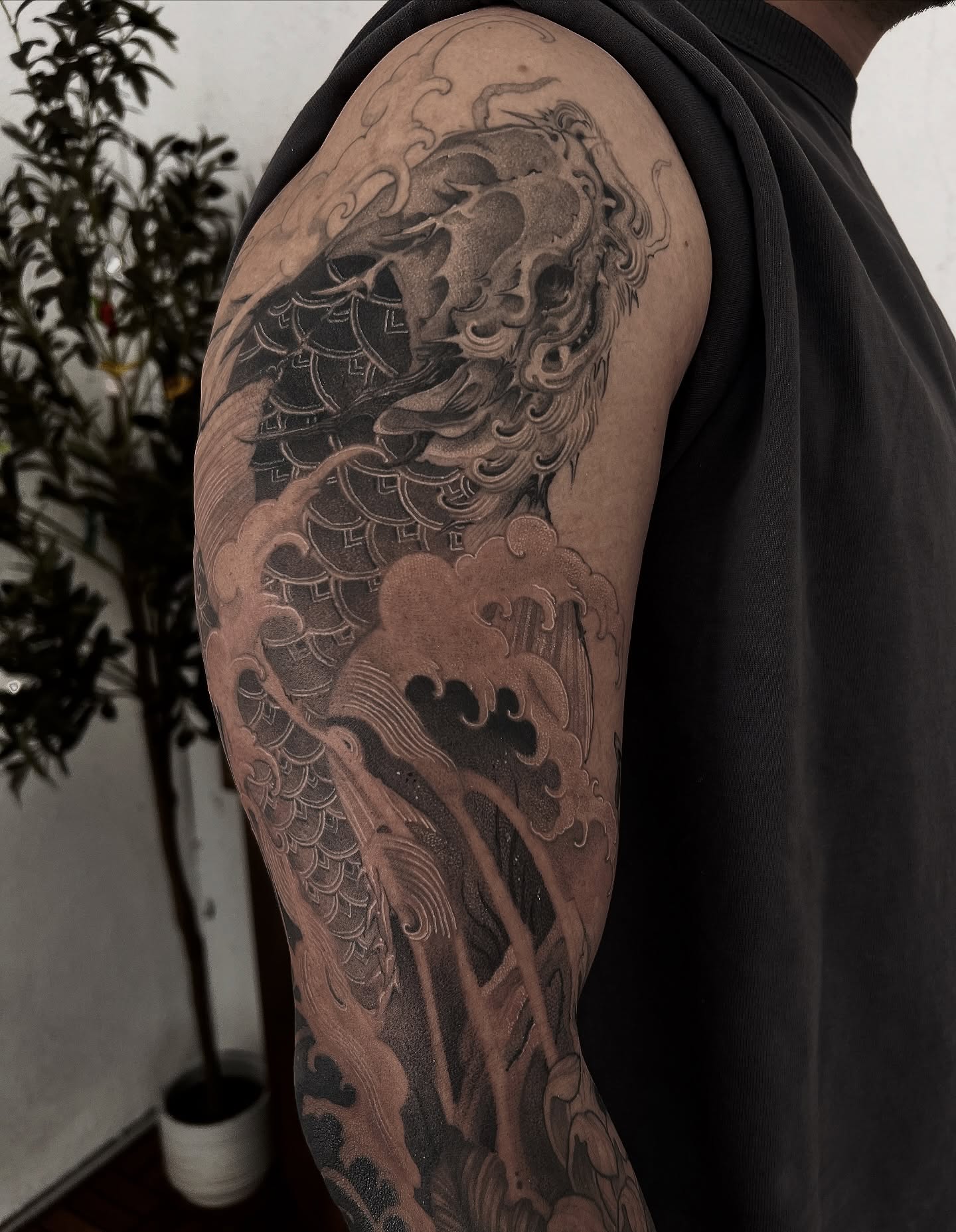 Dragon japanese irezumi tattoo on the upper arm by Joshua Hung, Alhambra, California
