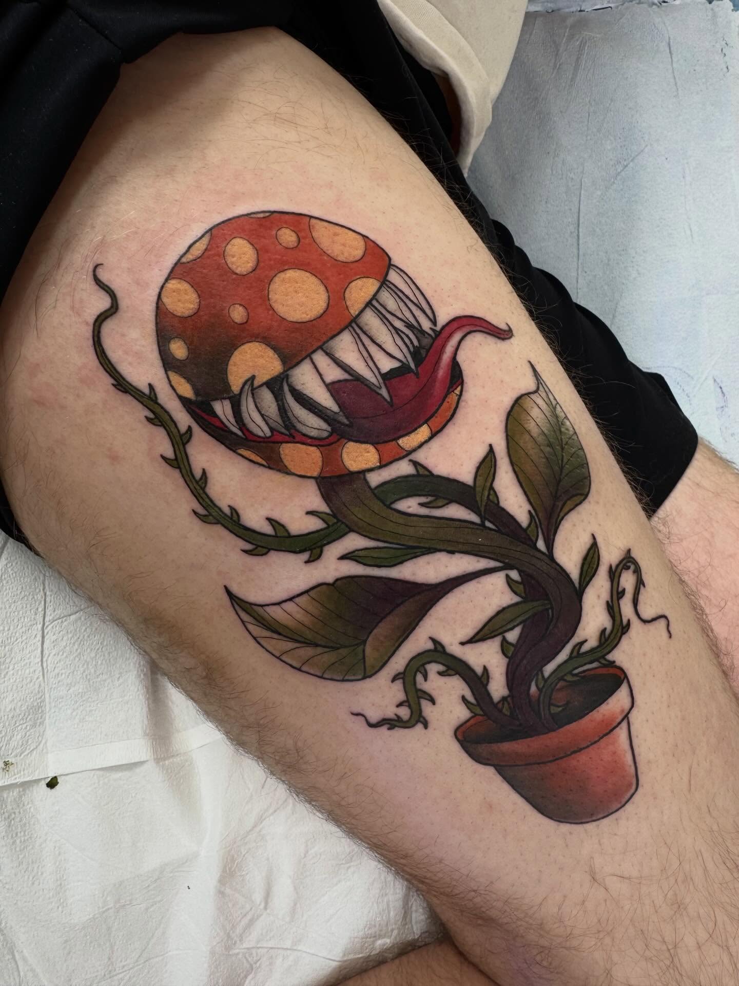 Fungus and plant dotwork tattoo on the thigh by Kyrsta Lannigan (she