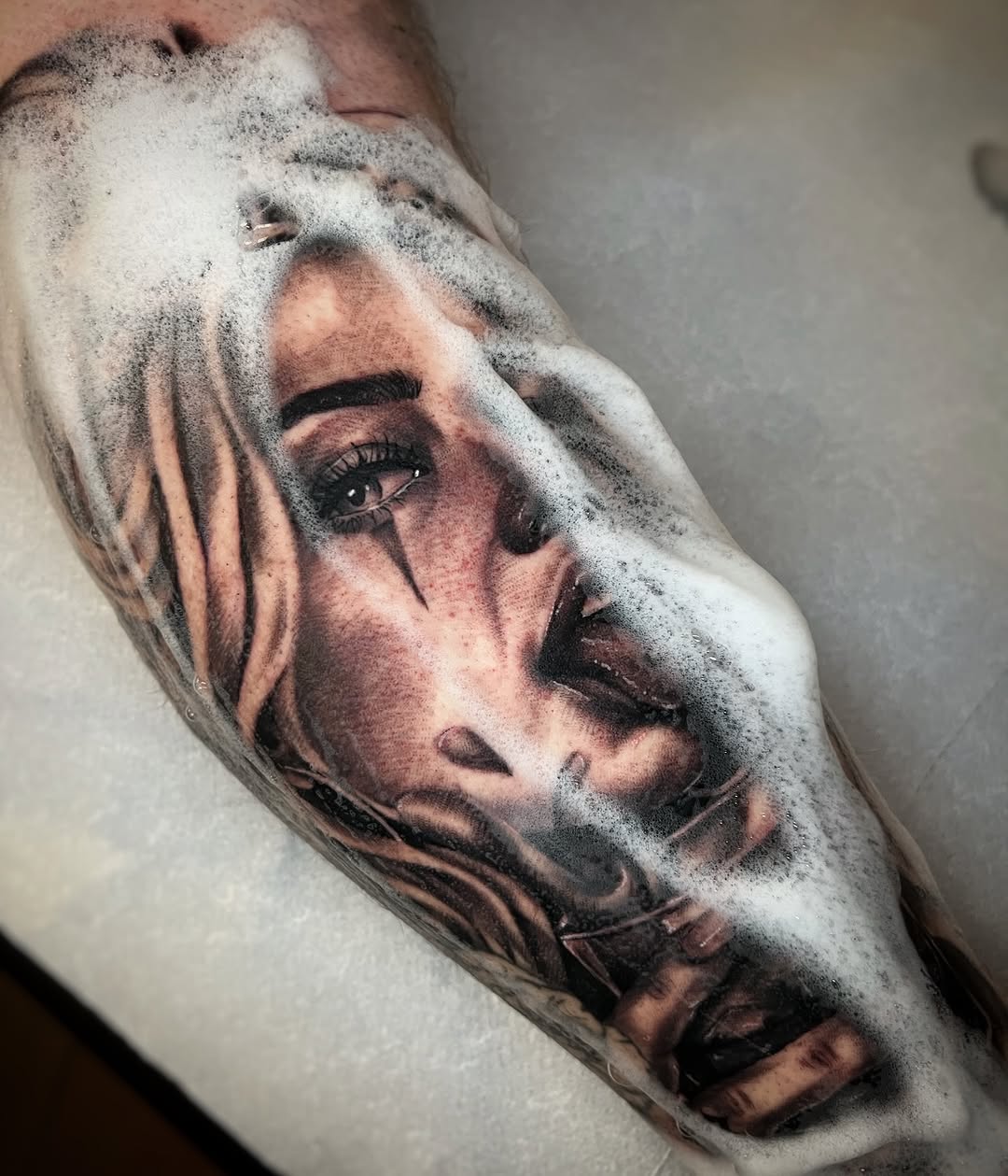 Portrait of a woman realism tattoo on the forearm by Blot_Tattoo