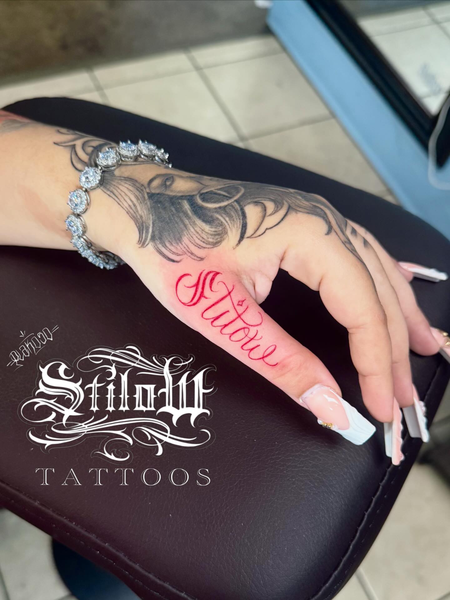 Portrait with cursive text realism tattoo on the hand by Stilow Memphis Tattoo Artist, Memphis, Tennessee