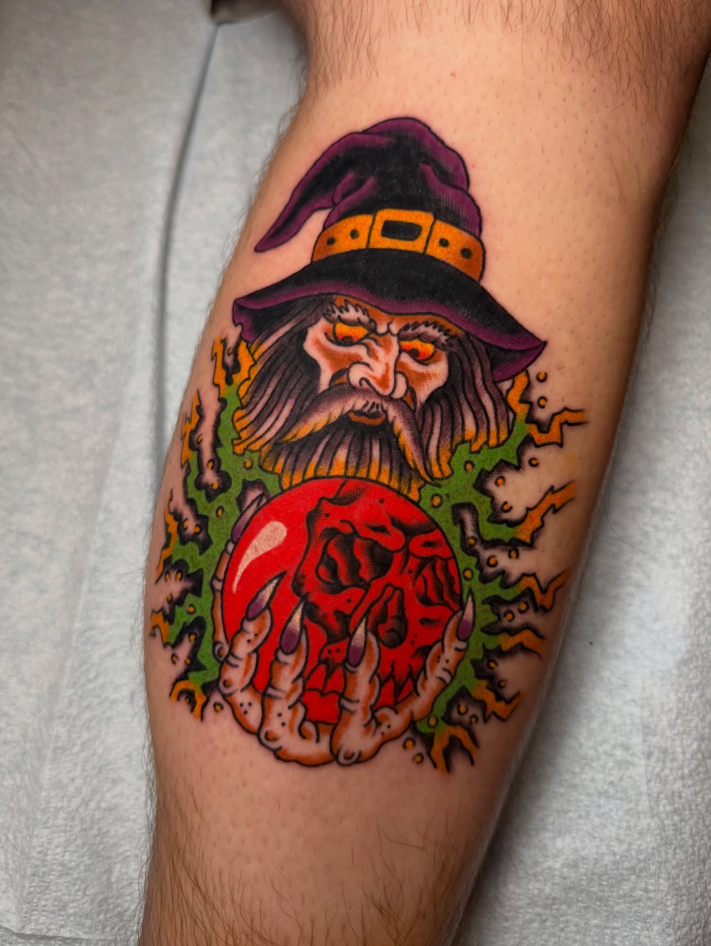 Wizard with crystal ball American traditional tattoo on the forearm by Tyler Brown, San Diego, California