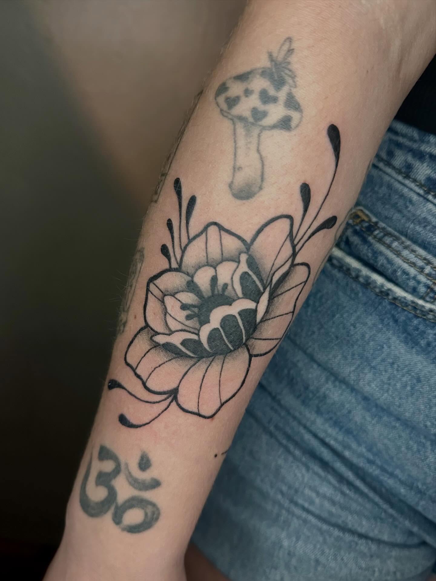 Flower black and grey tattoo on the forearm by Jadelin, San Francisco, California
