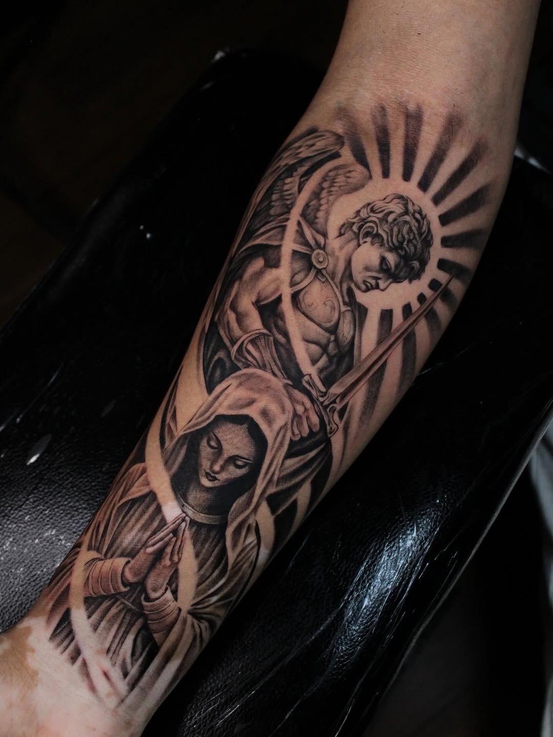 Angel and praying woman realism tattoo on the forearm by 𝕵𝖎𝖒𝖎 𝕯𝖊𝕽𝖔𝖘𝖆🥀, Everett, Washington