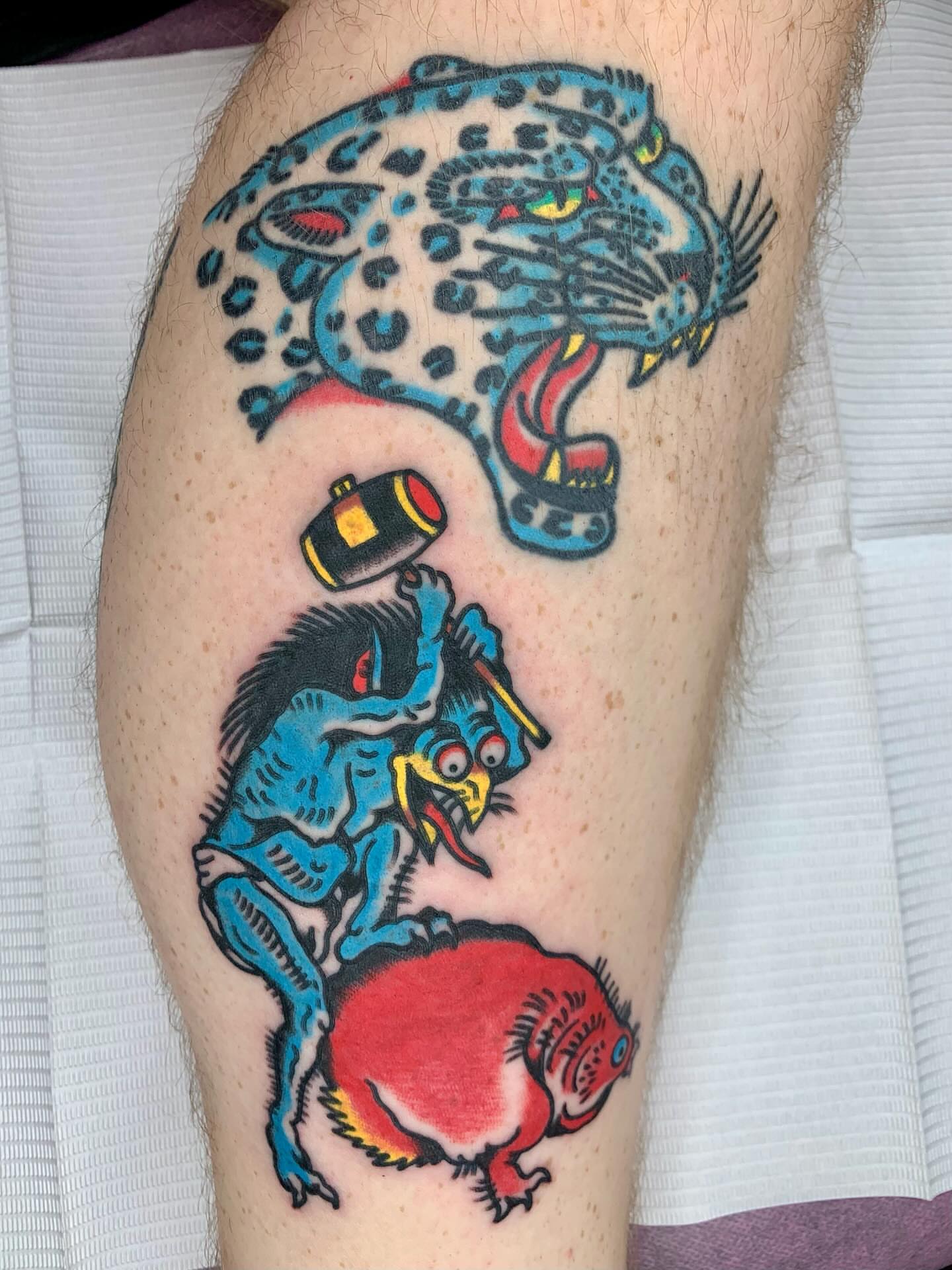 Jaguar and devil American traditional tattoo on the leg by Keegan Bergen