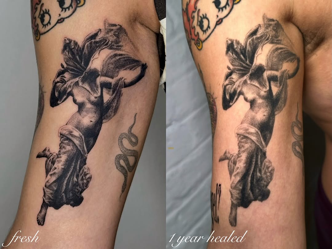Statue with flowing fabric realism tattoo on the forearm by kale