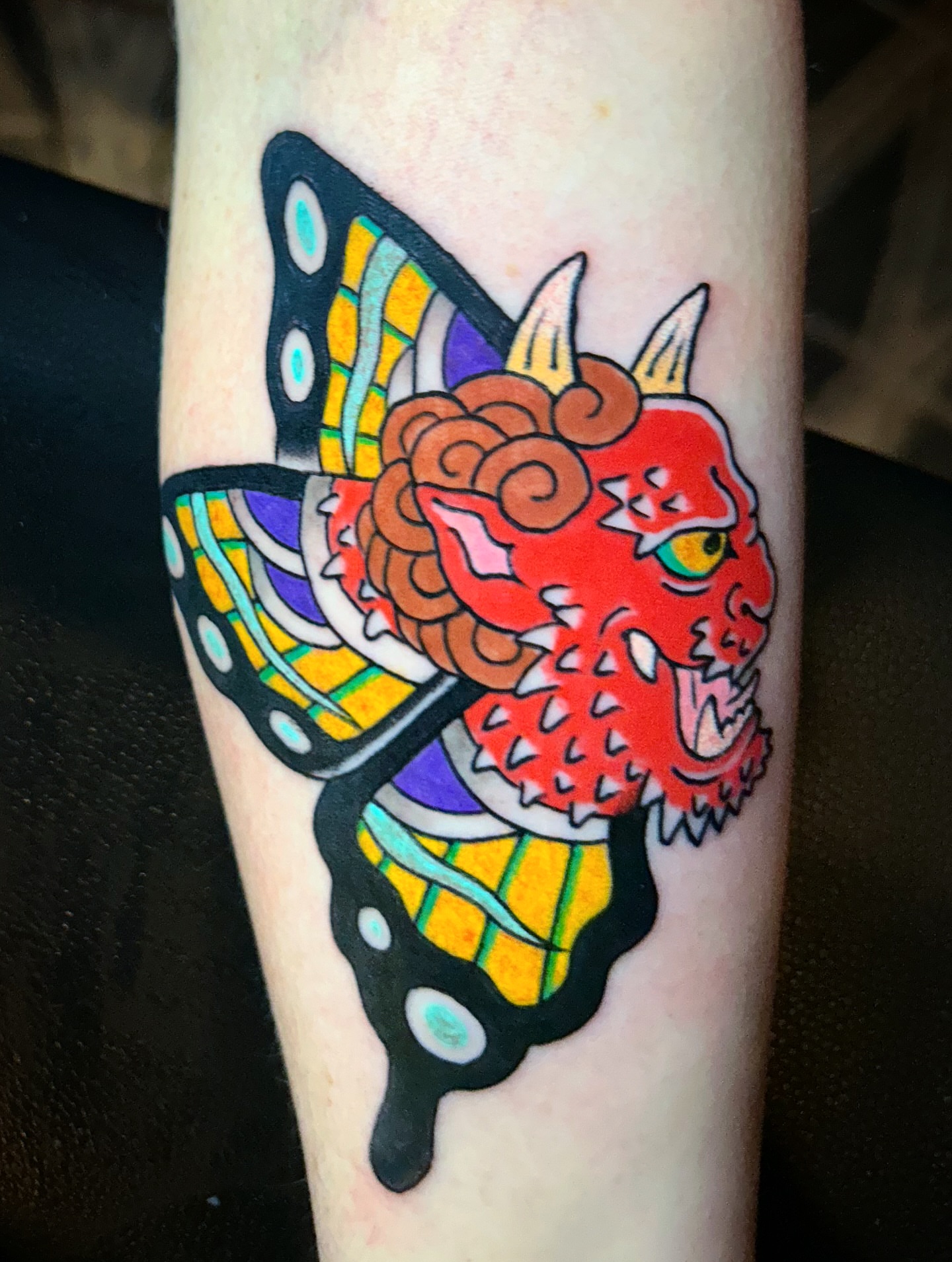 Dragon and butterfly American traditional tattoo on the forearm by Alex Citrone - Martha’s Vineyard Tattoo