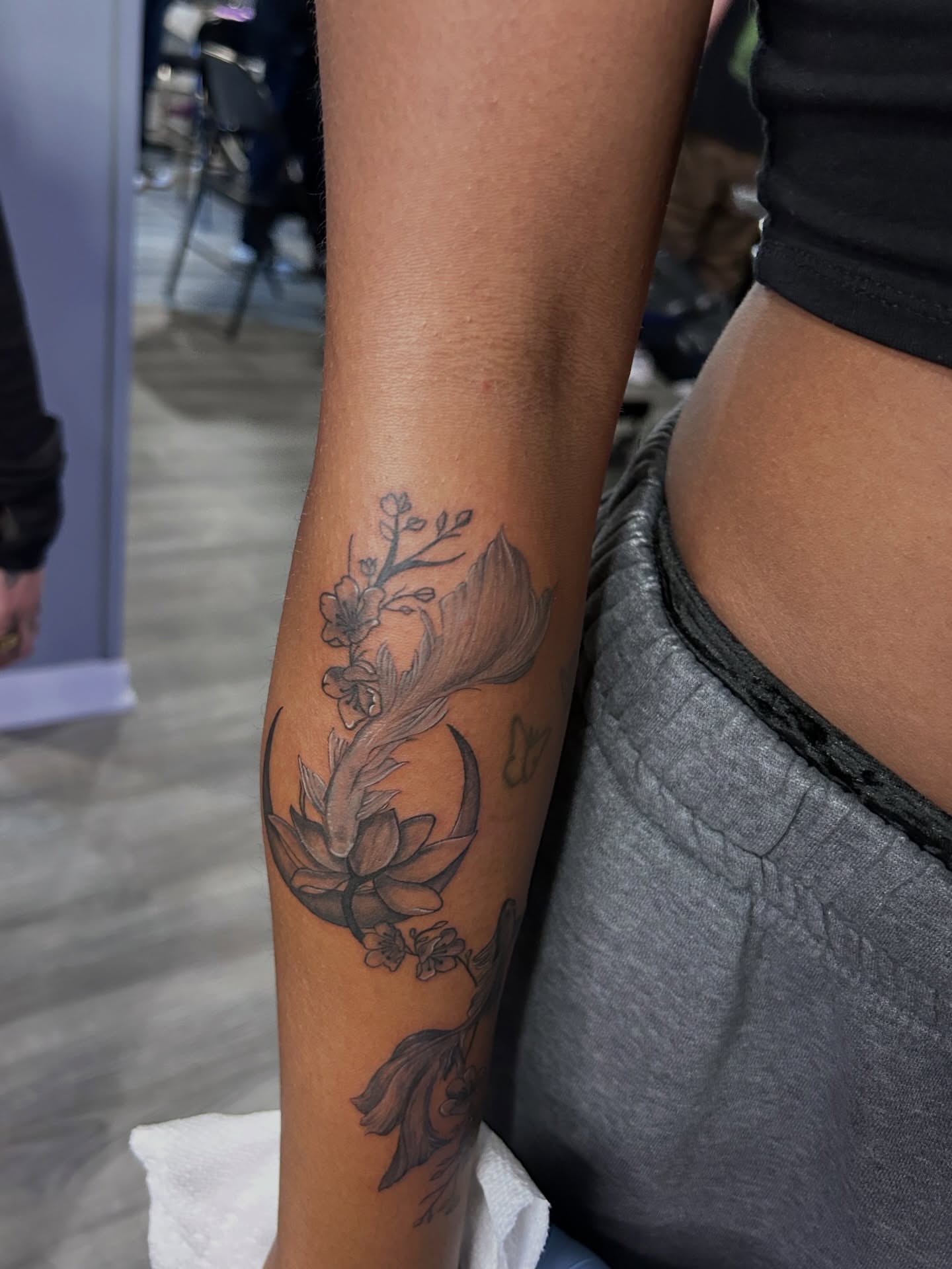Lotus flower black and grey tattoo on the forearm by Oto_art