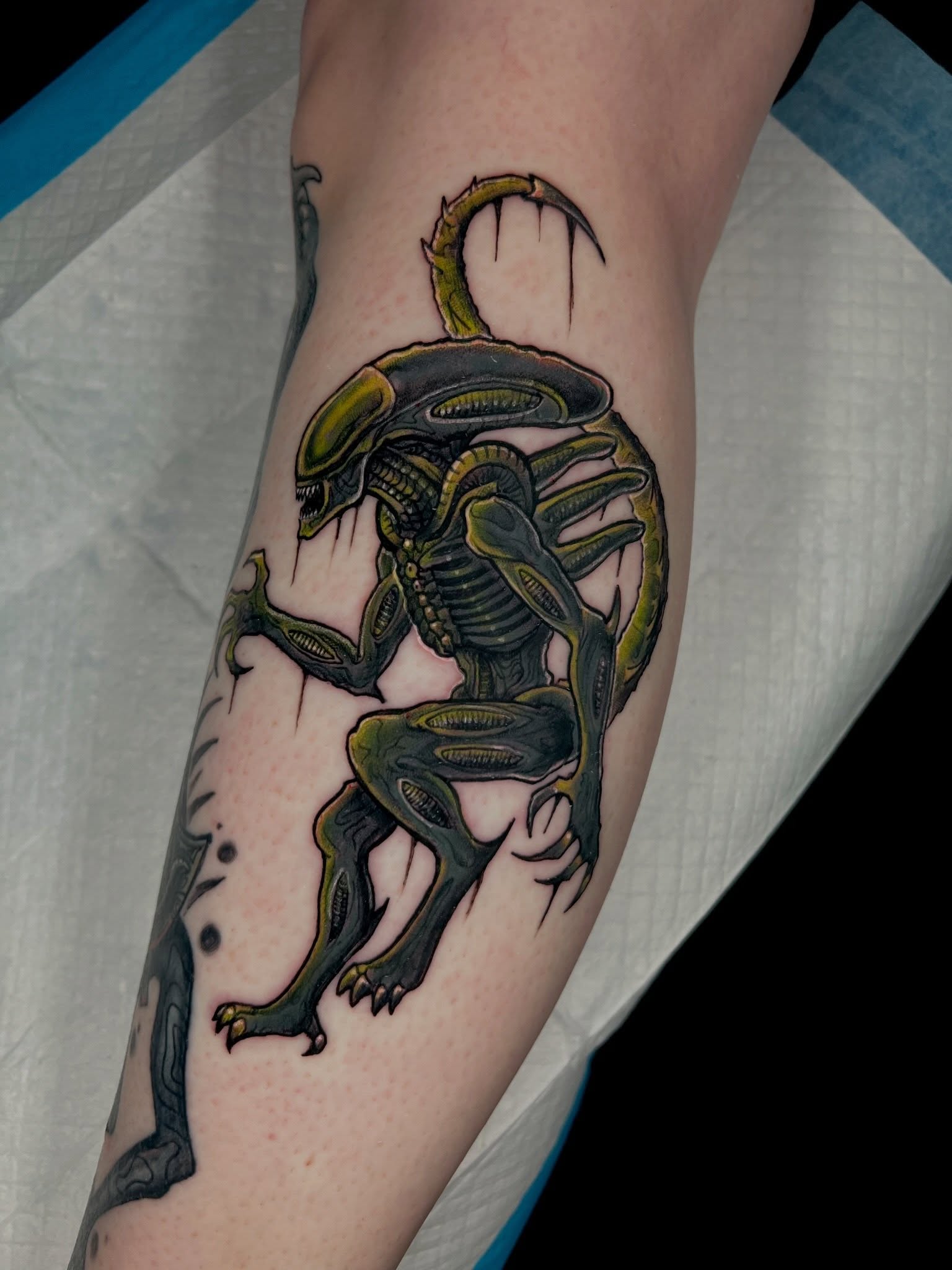 Alien creature realism tattoo on the forearm by Brandon Durbin