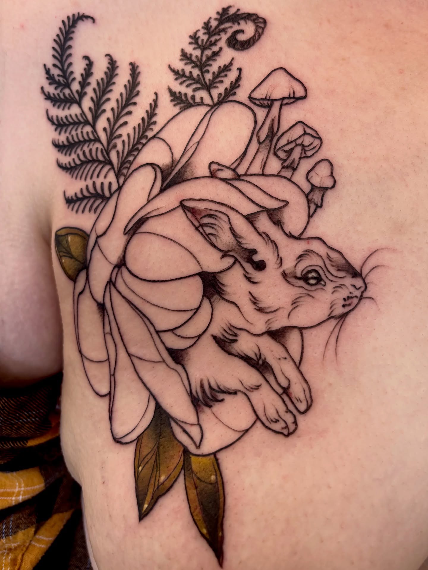 Rabbit and flower black and grey tattoo on the shoulder by Cricket Elijah Cervidae