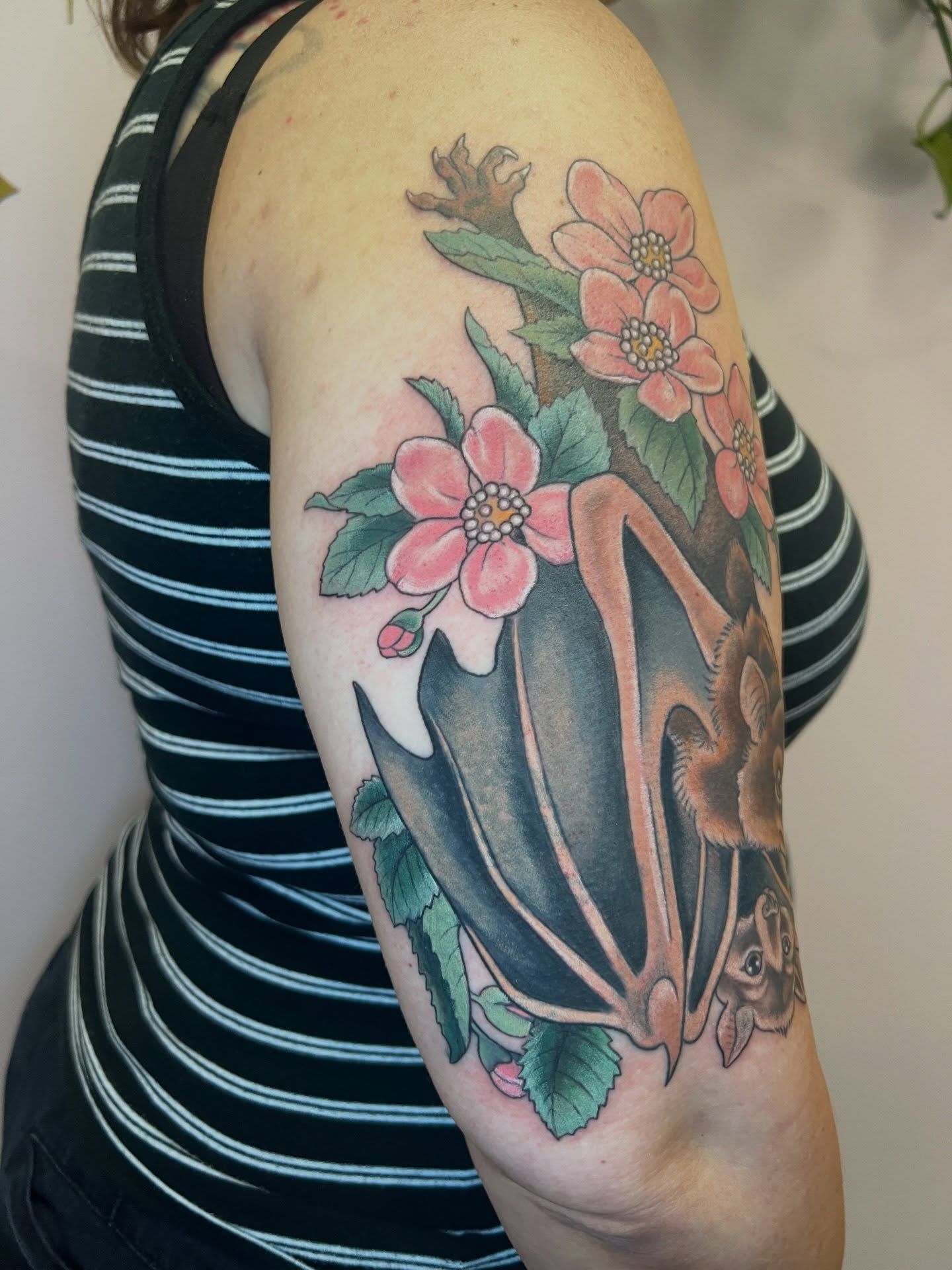 Bat and flowers American traditional tattoo on the upper arm by Tattoos by Shashonna - Portland Tattoo Artist