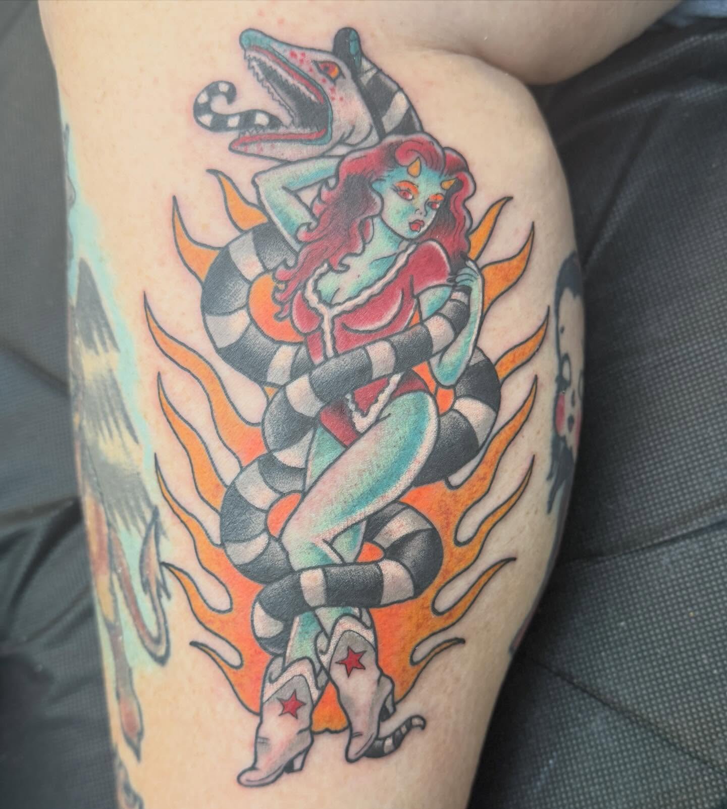 Cowgirl and snake American traditional tattoo on the thigh by Trent Parsley