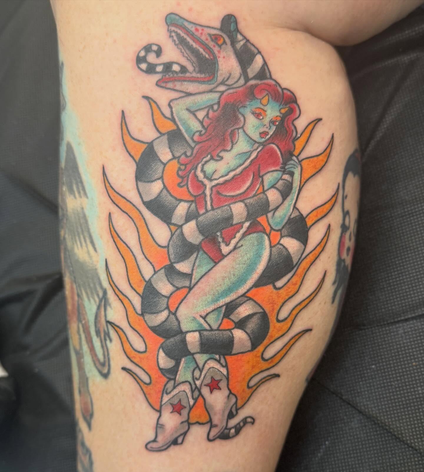 Snake and woman American traditional tattoo on the thigh by Trent Parsley