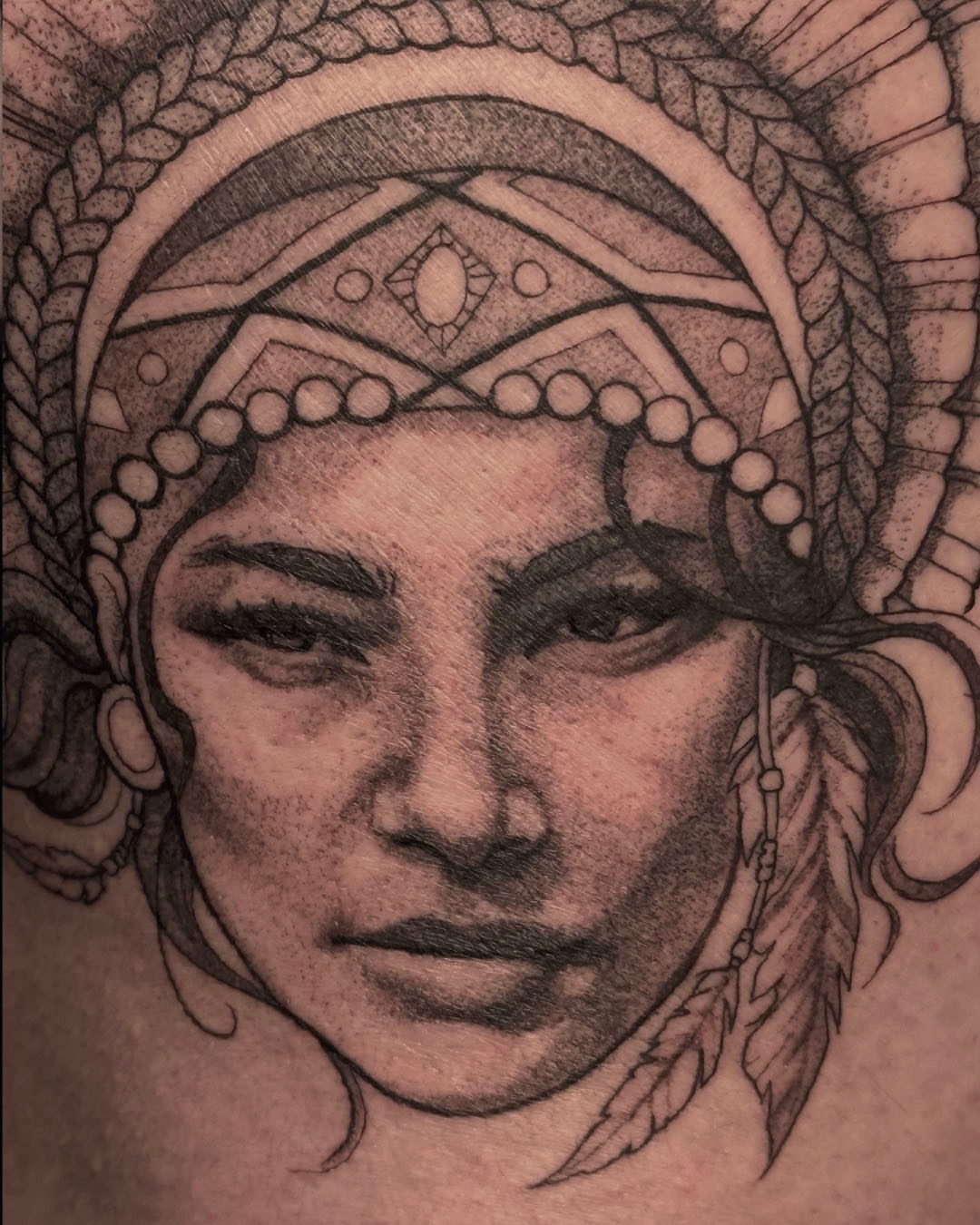 Woman's face realism tattoo on the head by Erin Isaacs