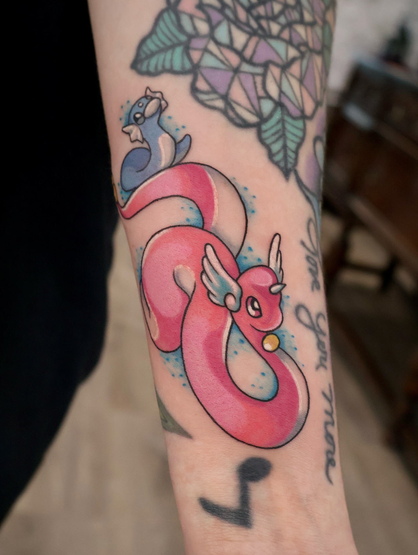 Tattoo by @rachelw.tattoo — watercolor, geometric