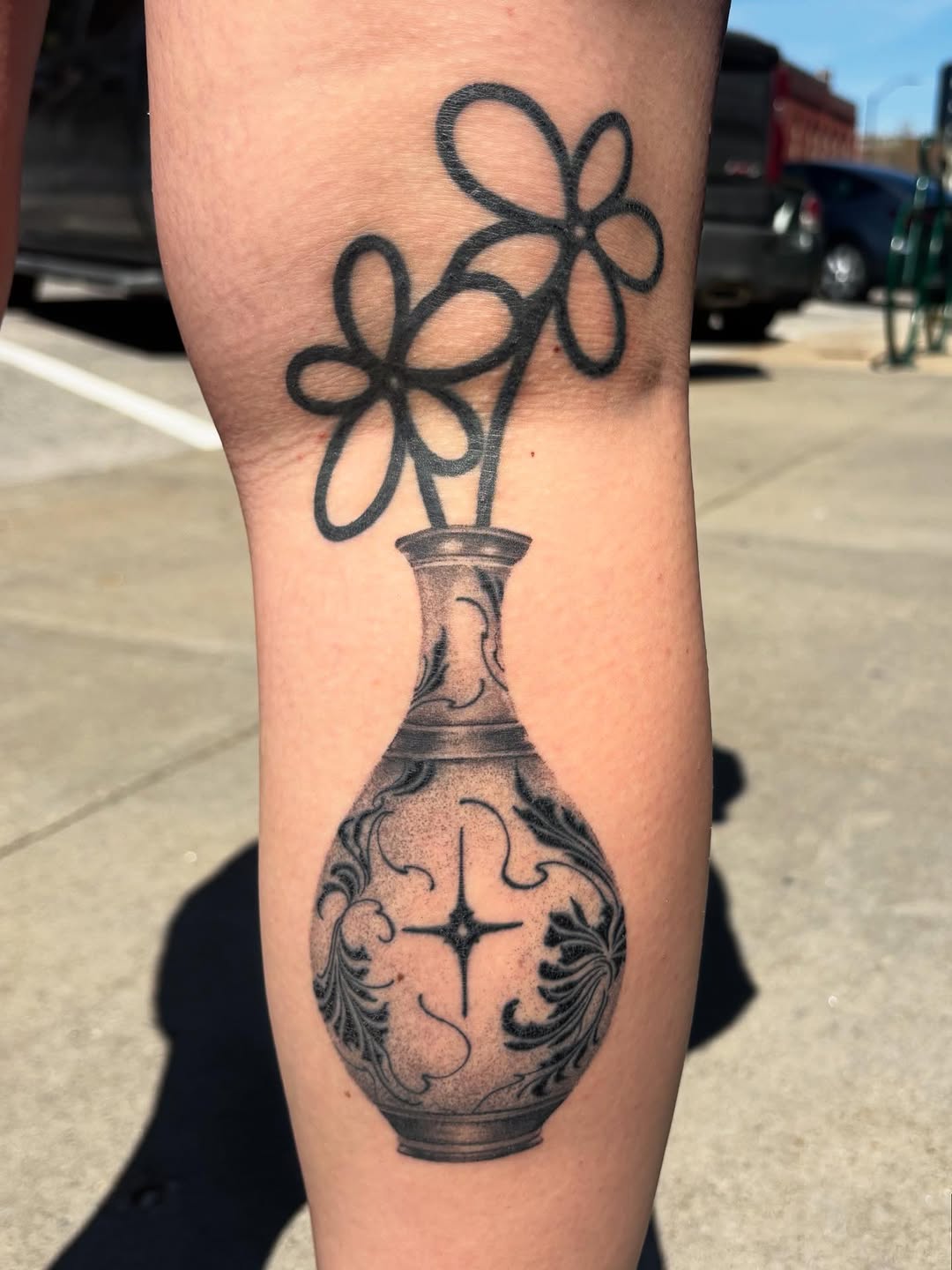 Vase with flowers surrealism tattoo on the forearm by Anna Kathleen, Des Moines, Iowa