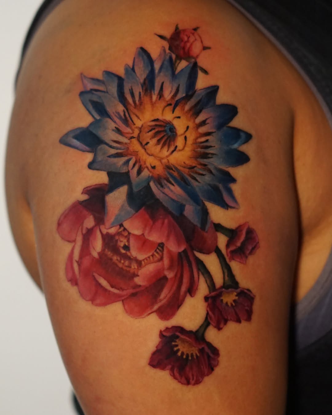 Flower bouquet realism tattoo on the shoulder by San Diego Color Realism and Neotraditional