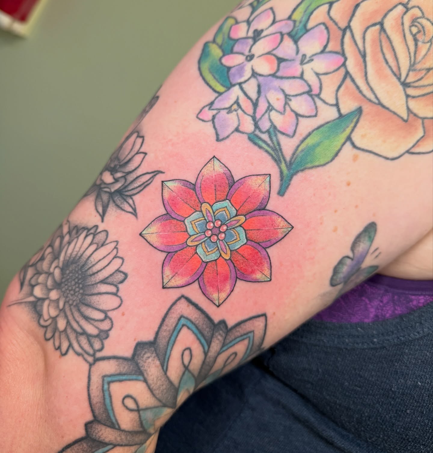 Floral arrangement dotwork tattoo on the forearm by Koryn Donnelly