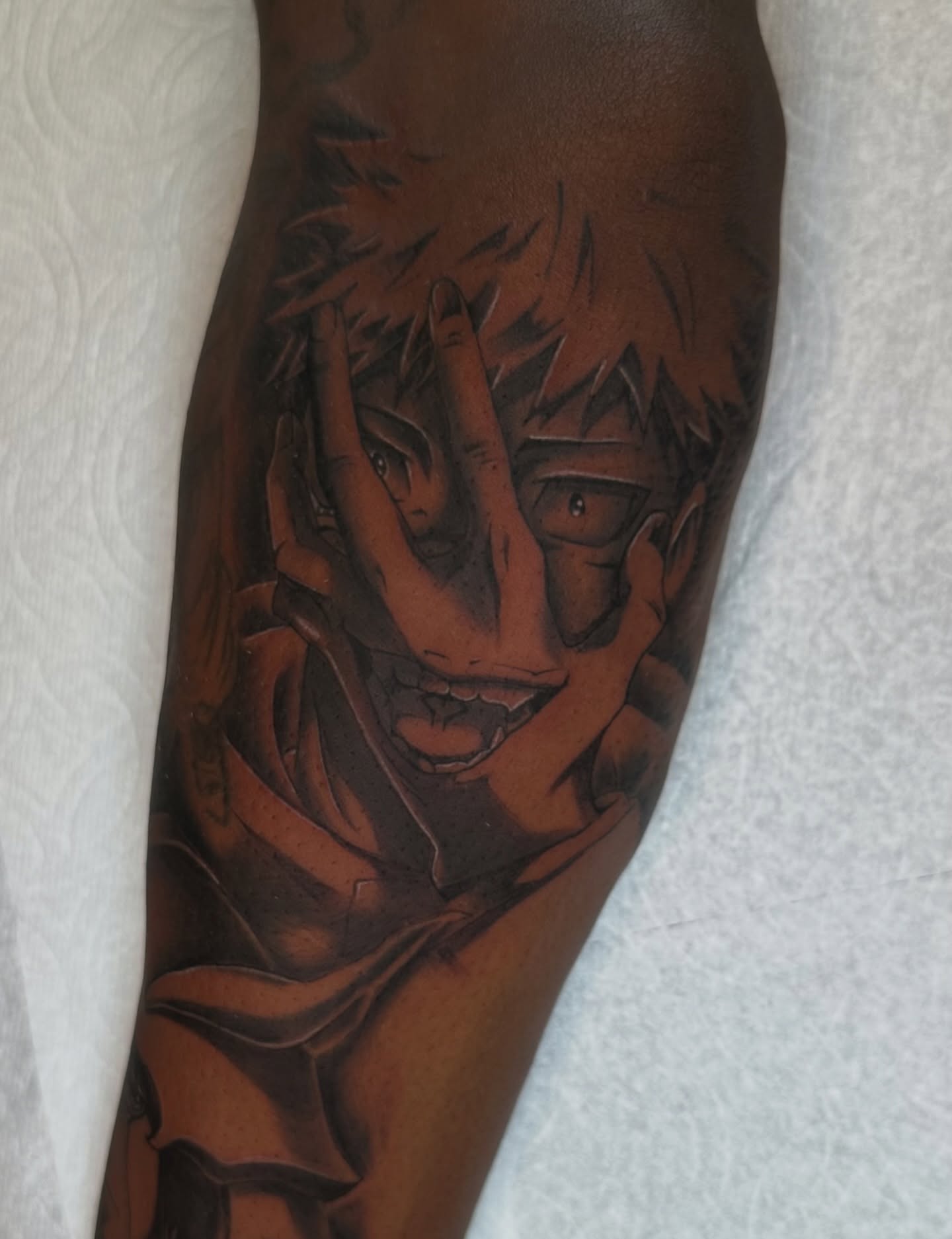 Anime character anime tattoo on the forearm by Mando