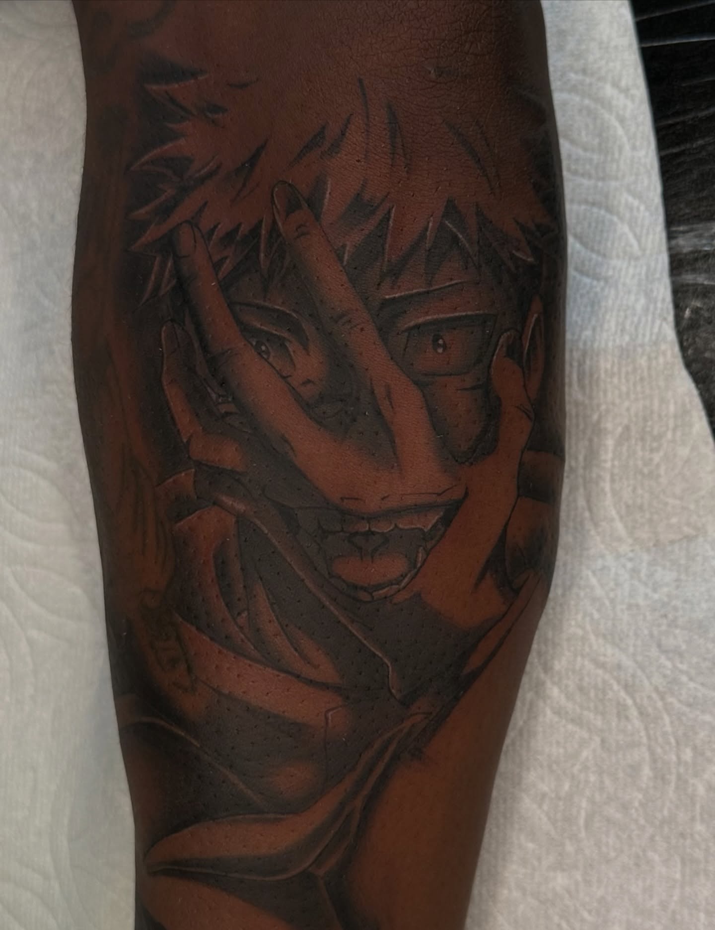 Anime character anime tattoo on the forearm by Mando