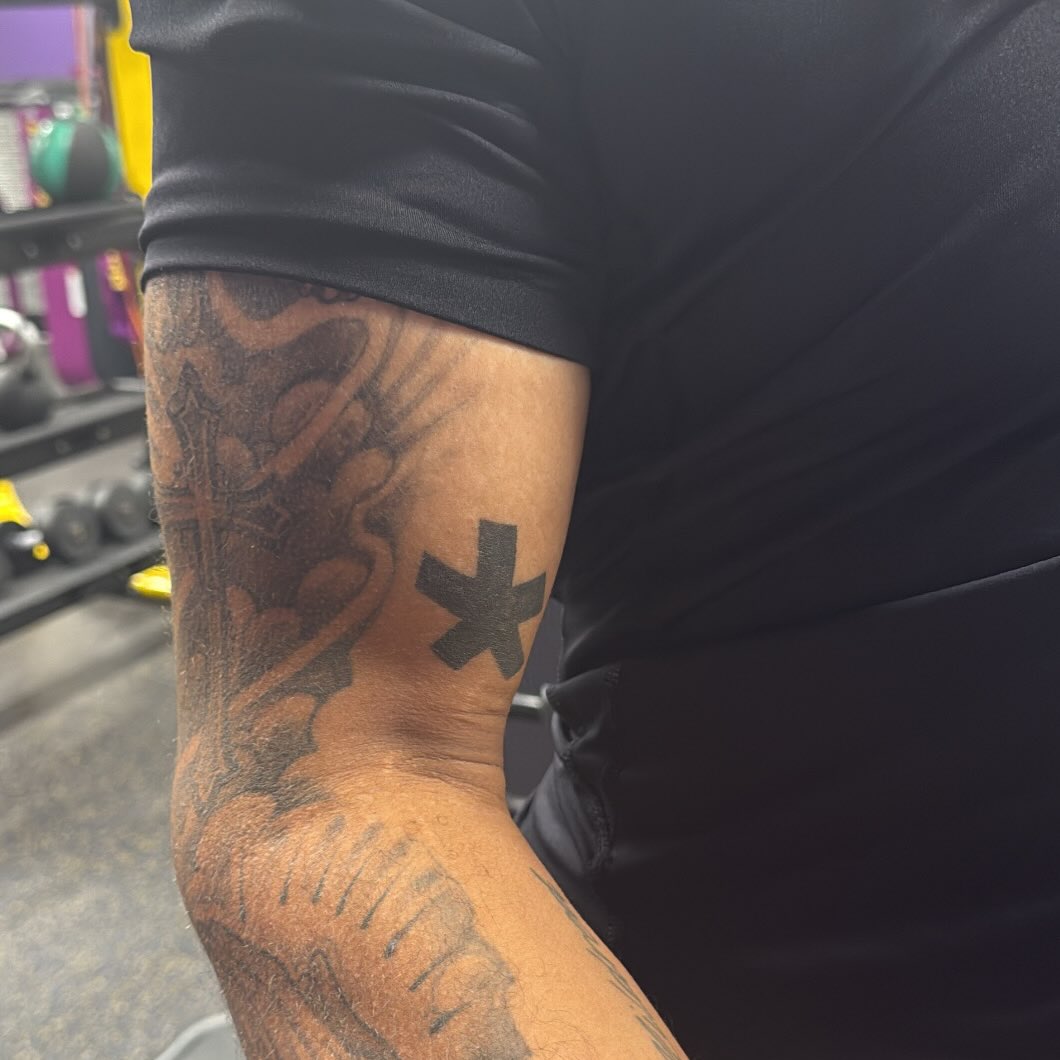 Asterisk symbol tattoo on the forearm by ๐ฆ