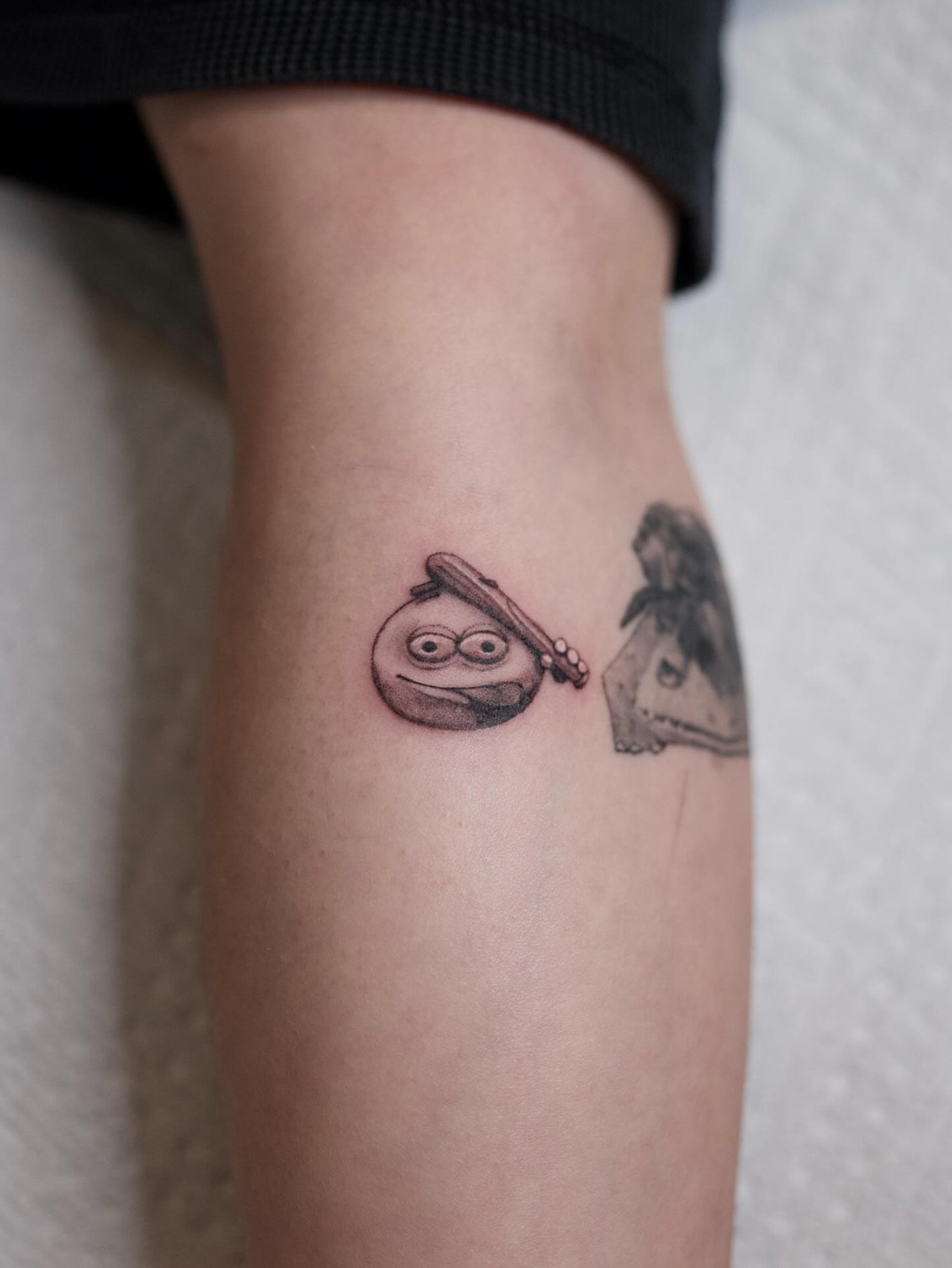 Robot black and grey tattoo on the forearm by Dylan Coverdale