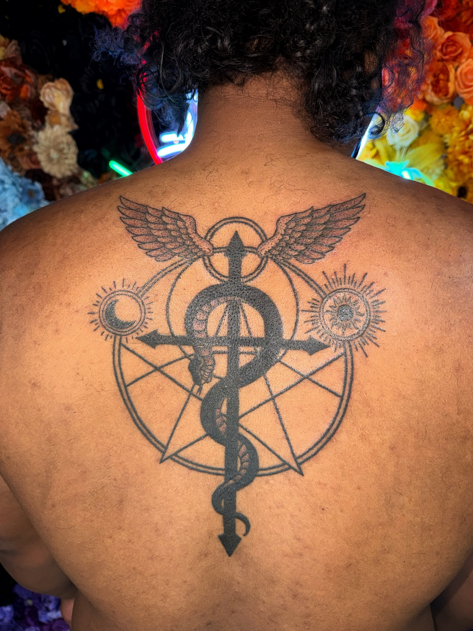 Medical caduceus black and grey tattoo on the back by Handpoke Tattoo Artist, Minneapolis, Minnesota