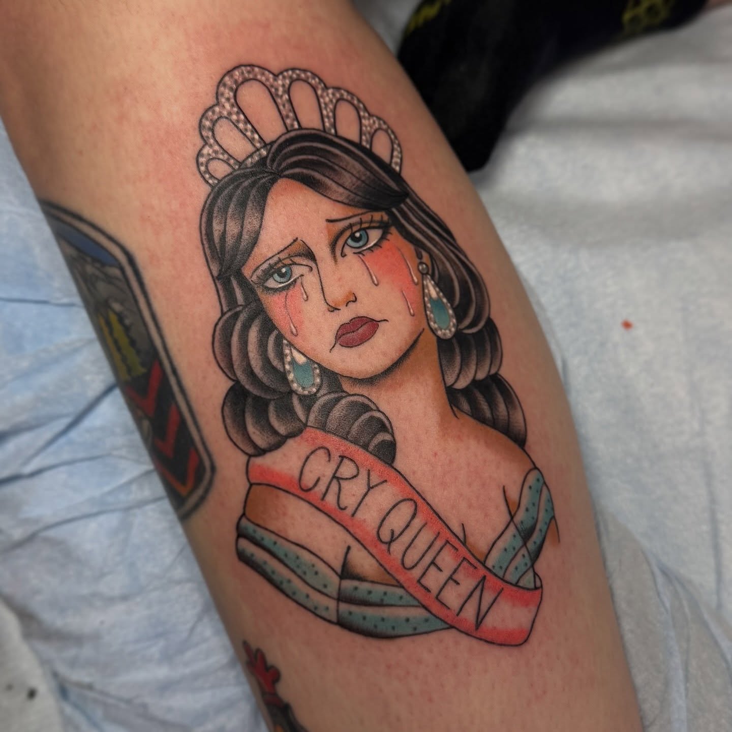 Crying queen American traditional tattoo on the forearm by Kaley, Des Moines, Iowa