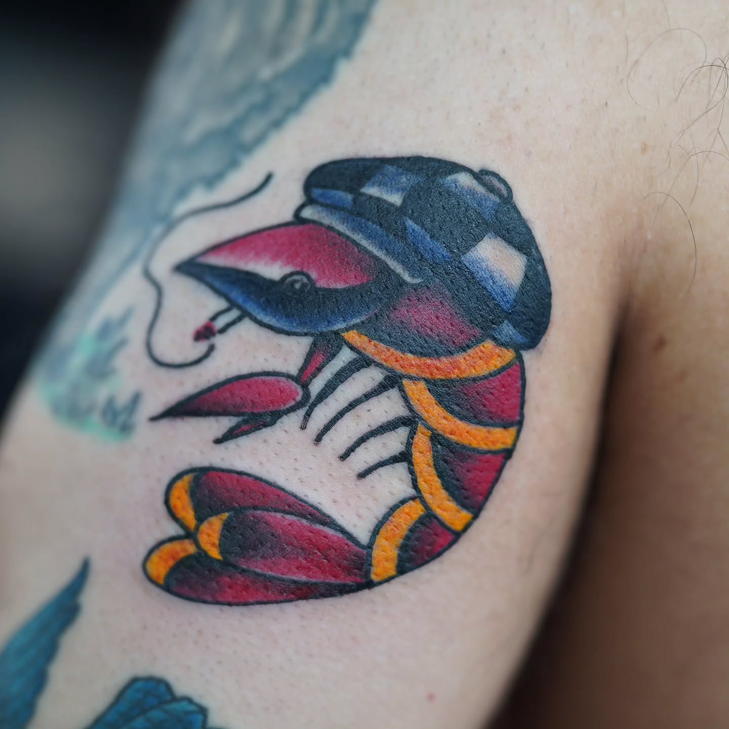 Lobster American traditional tattoo on the upper arm by Adam Lunoe, Seattle, Washington