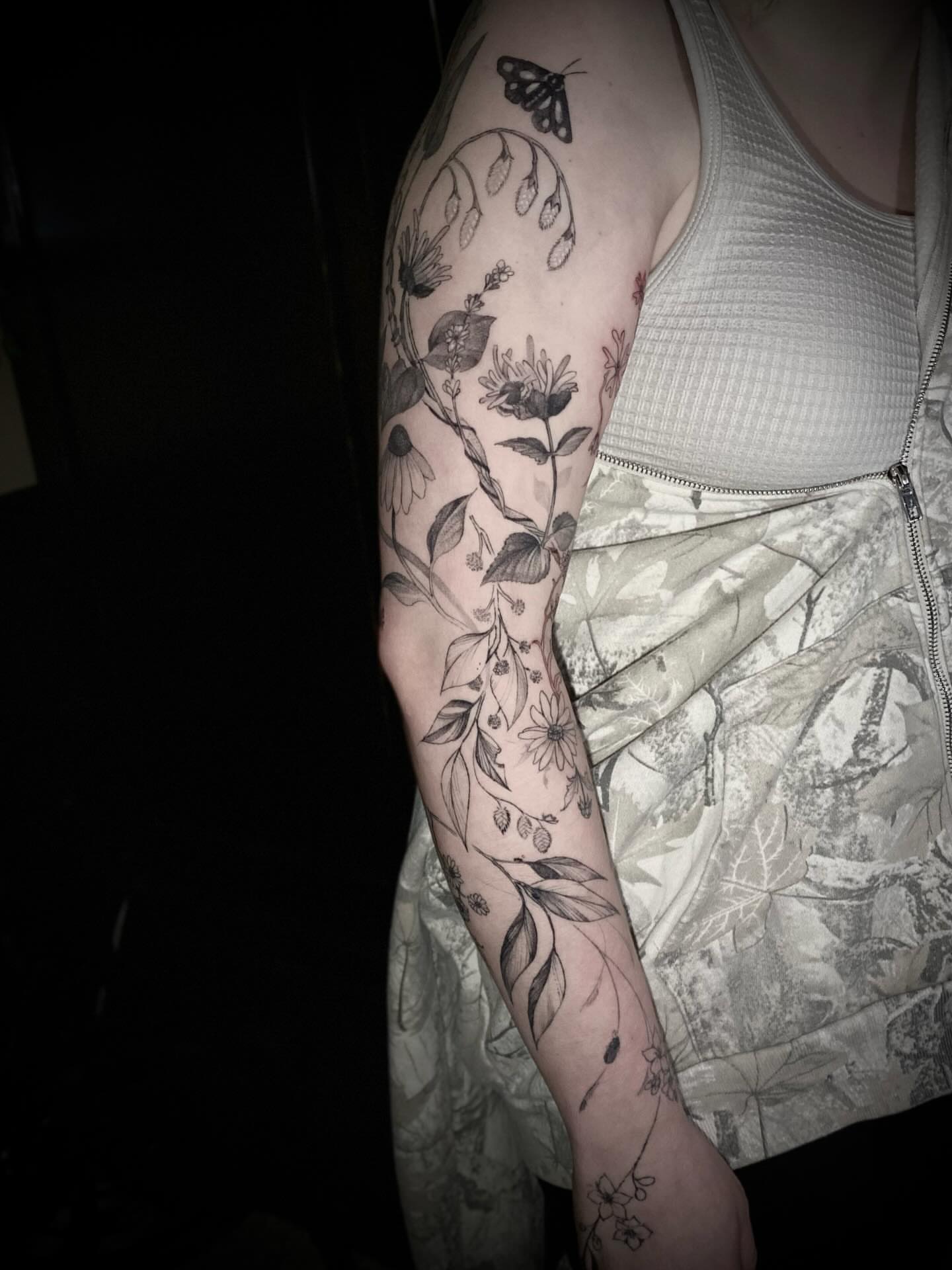 Botanical black and grey tattoo on the forearm by Olivia Scott - Kansas Tattoo Artist