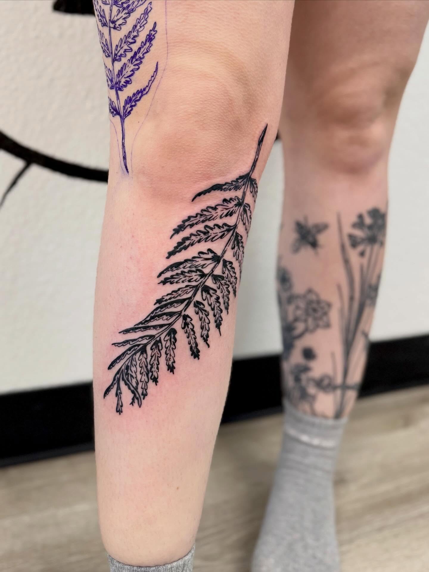 Fern black and grey tattoo on the forearm by Peggy