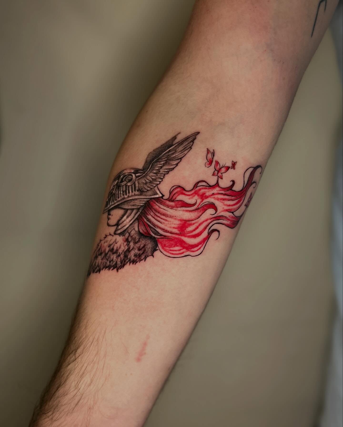 Flaming rose with bird neo-traditional tattoo on the forearm by Alex