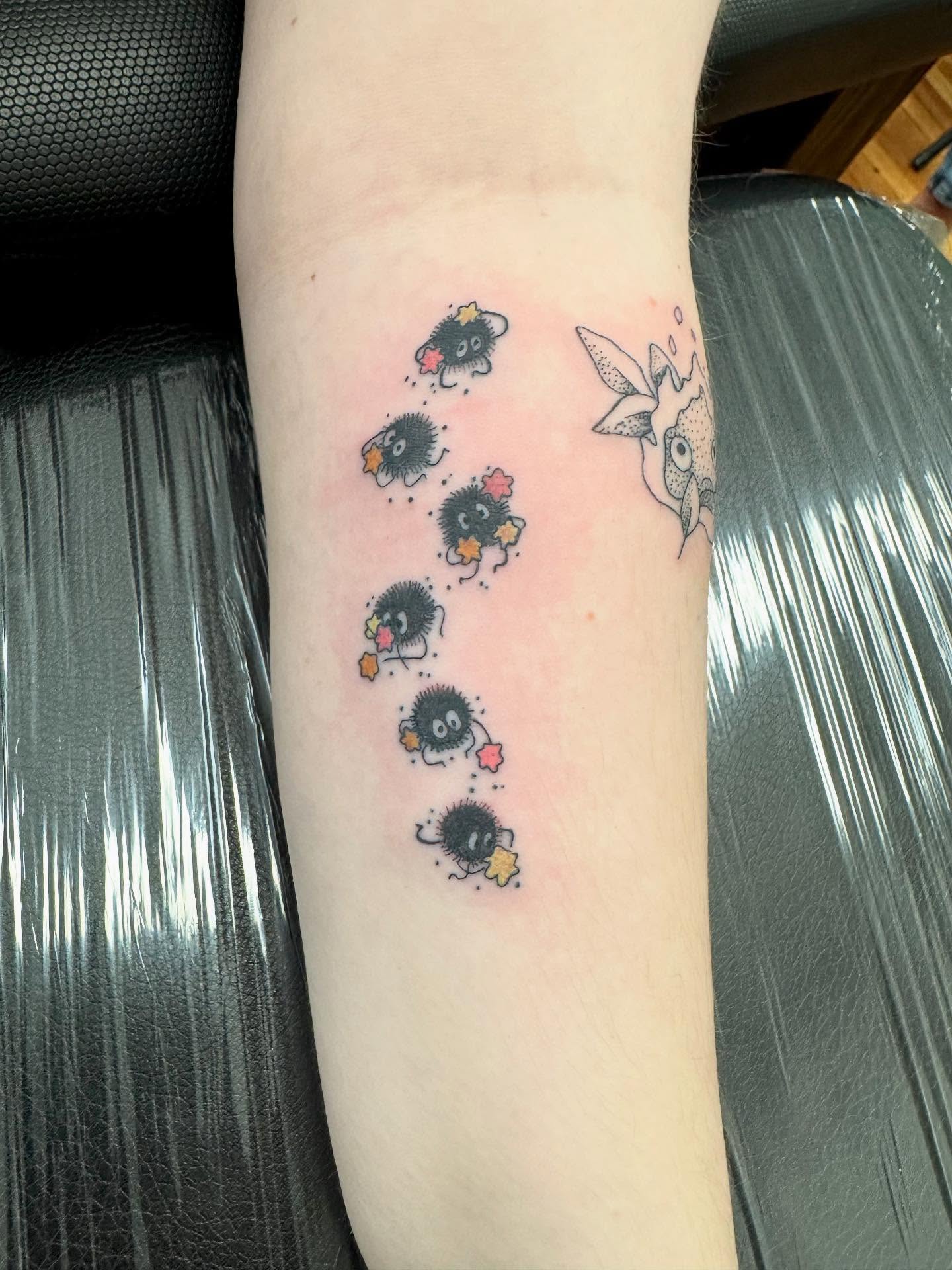 Urchins and starfish dotwork tattoo on the forearm by C.J. Pennington