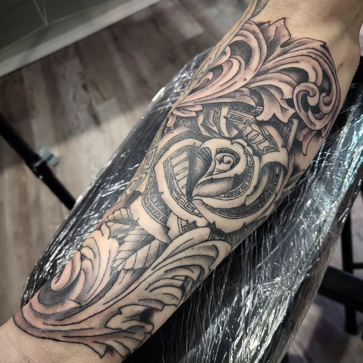 Rose geometric tattoo on the forearm by Sloan Smith