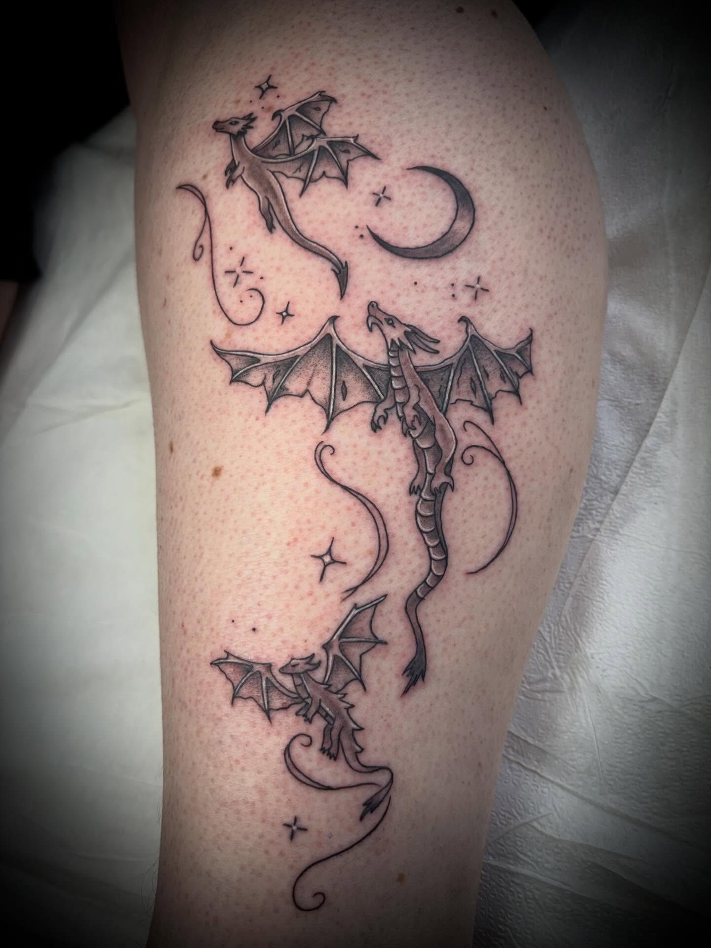 Dragons black and grey tattoo on the thigh by Gardner, Gardner, Massachusetts