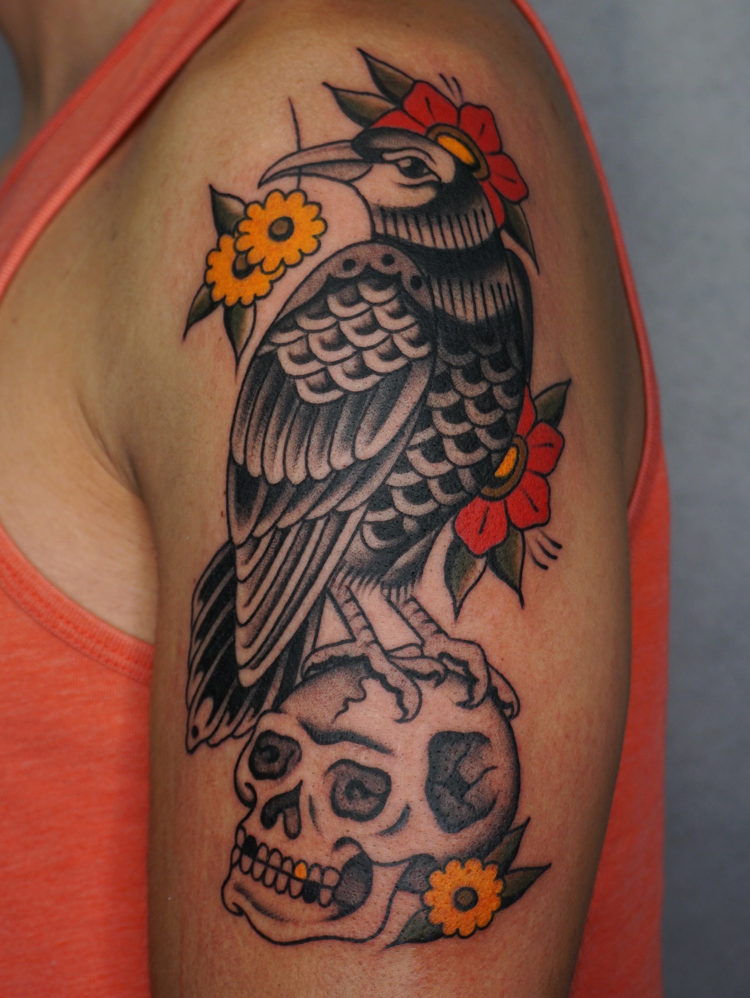 Bird and skull American traditional tattoo on the shoulder by Sarah Christine Tattoo, Calgary, Alberta